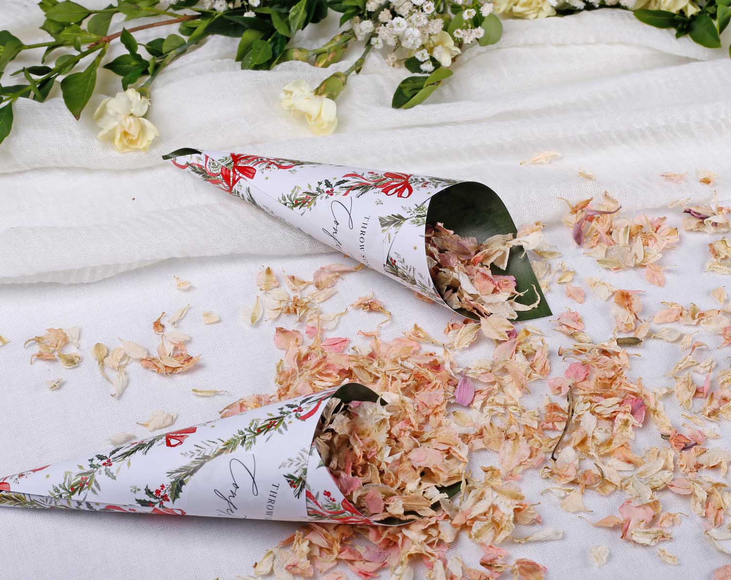 Winter Wedding Confetti Cones displayed with flower petals 