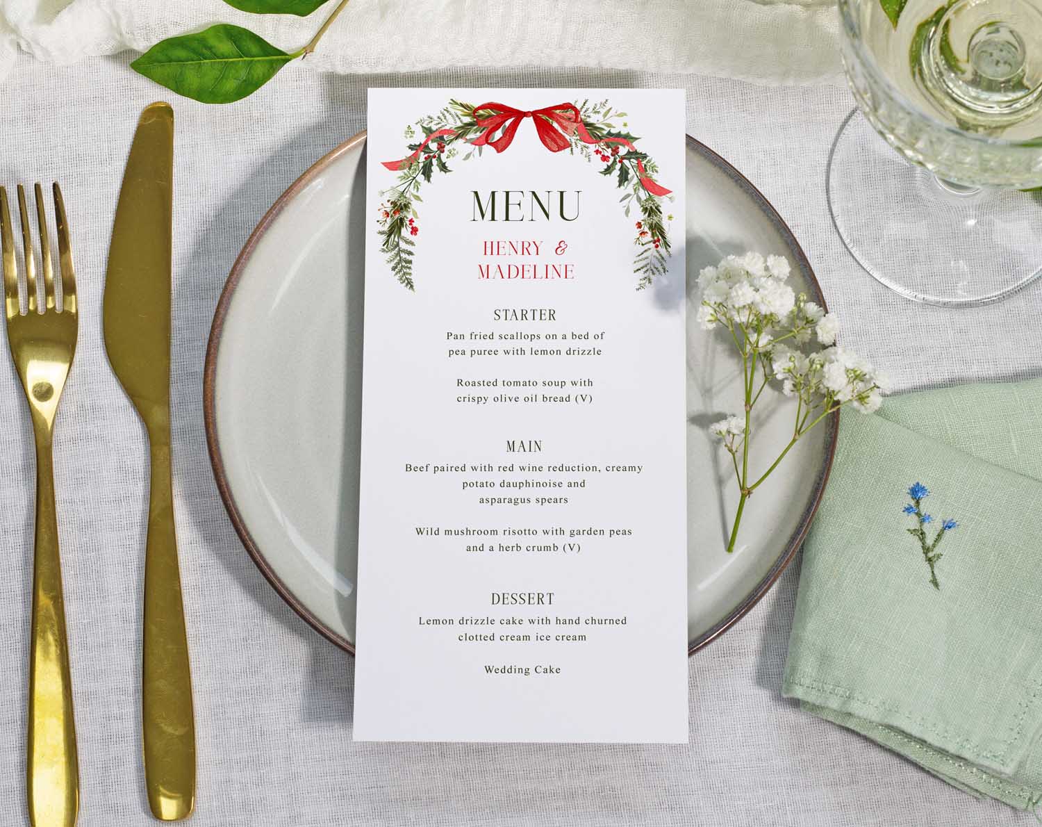 Winter Wedding Menus with festive red and green florals and foliage.