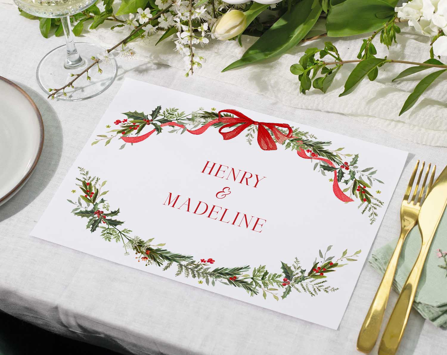 Winter Wedding Placemats featuring seasonal botanicals with names and red and green colour theme.