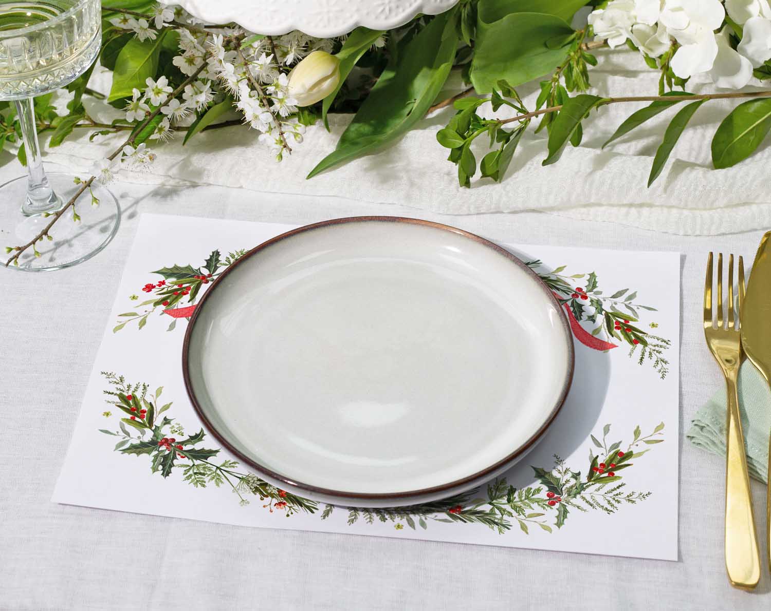Winter Wedding Placemats featuring winter botanicals with a white plate and elegant table setting for Christmas weddings.