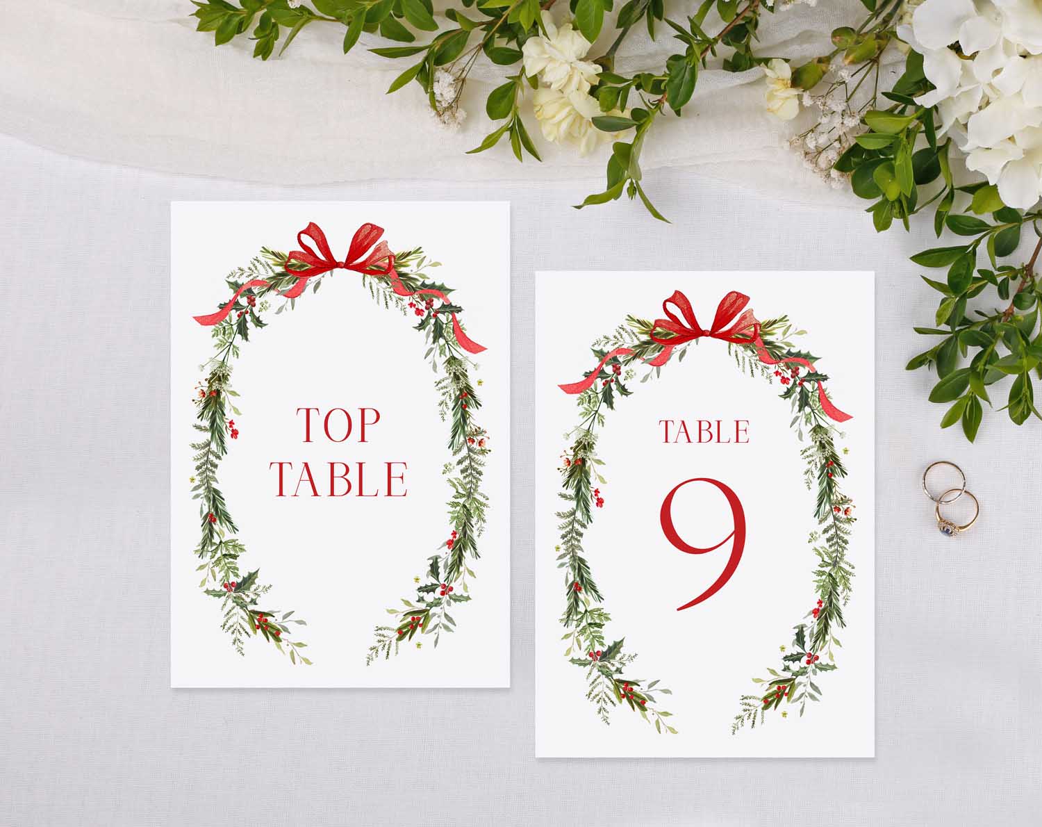 Winter Wedding Table Numbers featuring a floral design with ribbons for table identification.