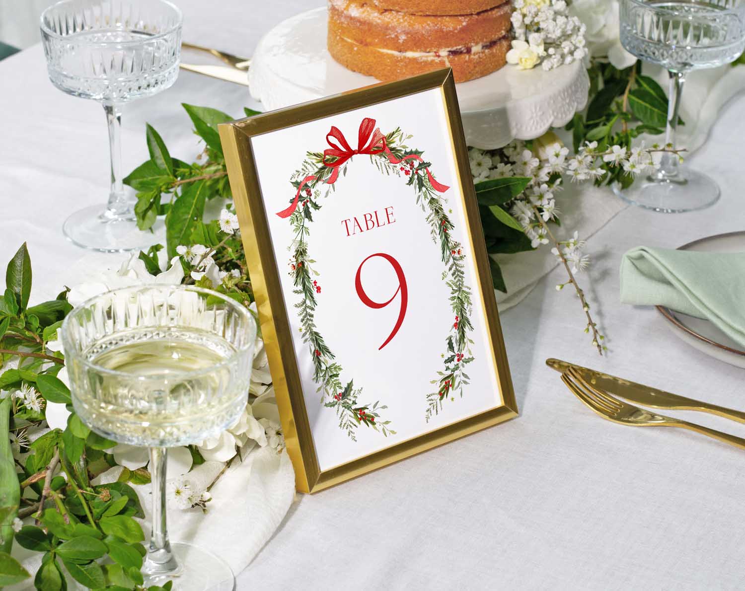 Winter Wedding Table Numbers displayed on a table setting with greenery and floral accents.