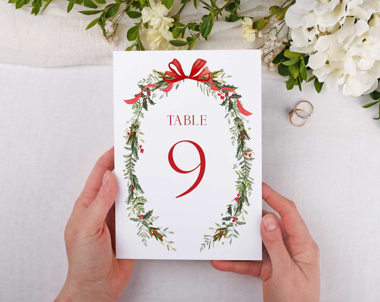 Winter Wedding Table Numbers featuring a floral design and red ribbon, showing Table 9 for seating arrangements.