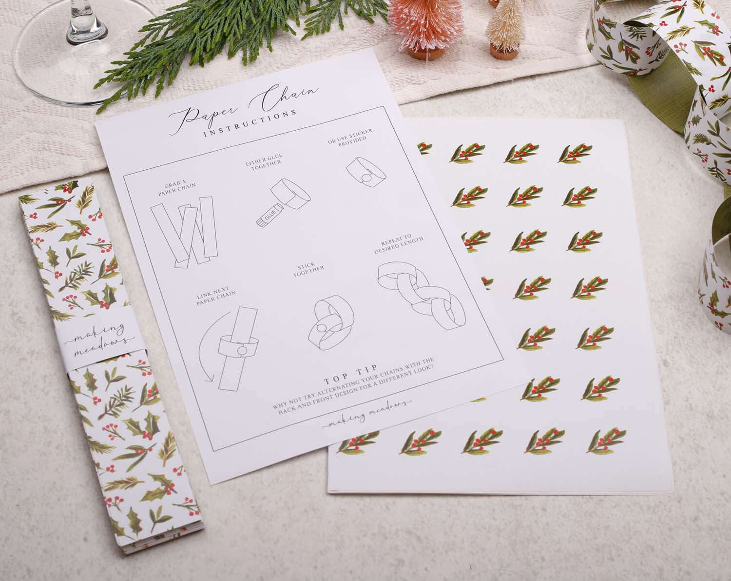 Holly Christmas Paper Chains instructions with decorative paper and design templates on a light background.