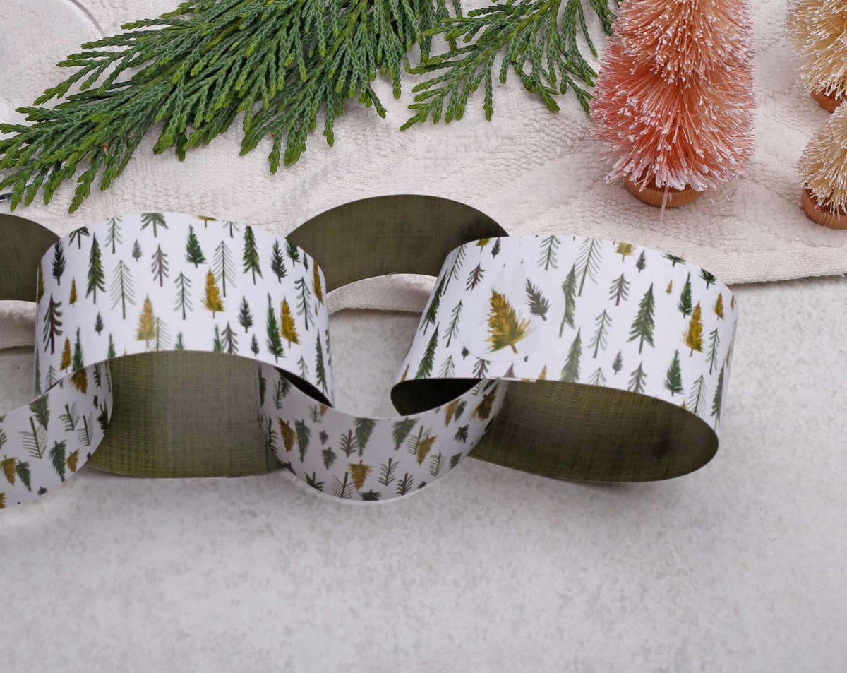 Forest Christmas Paper Chains Garland displayed with decorative trees on a neutral background.