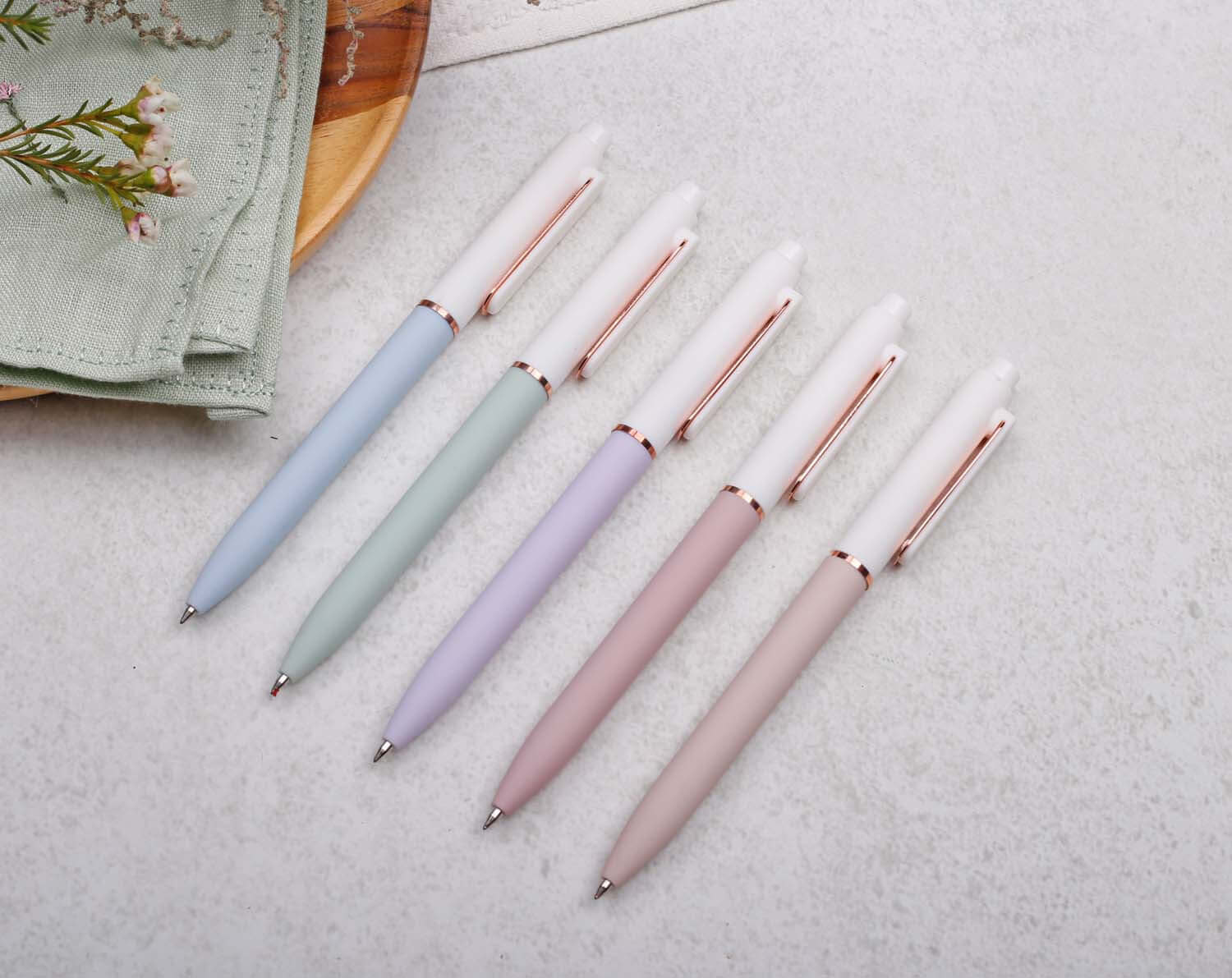 Lilac Gel Pen with Rose Gold Trim alongside other stylish gel pens in pastel colors for smooth writing.