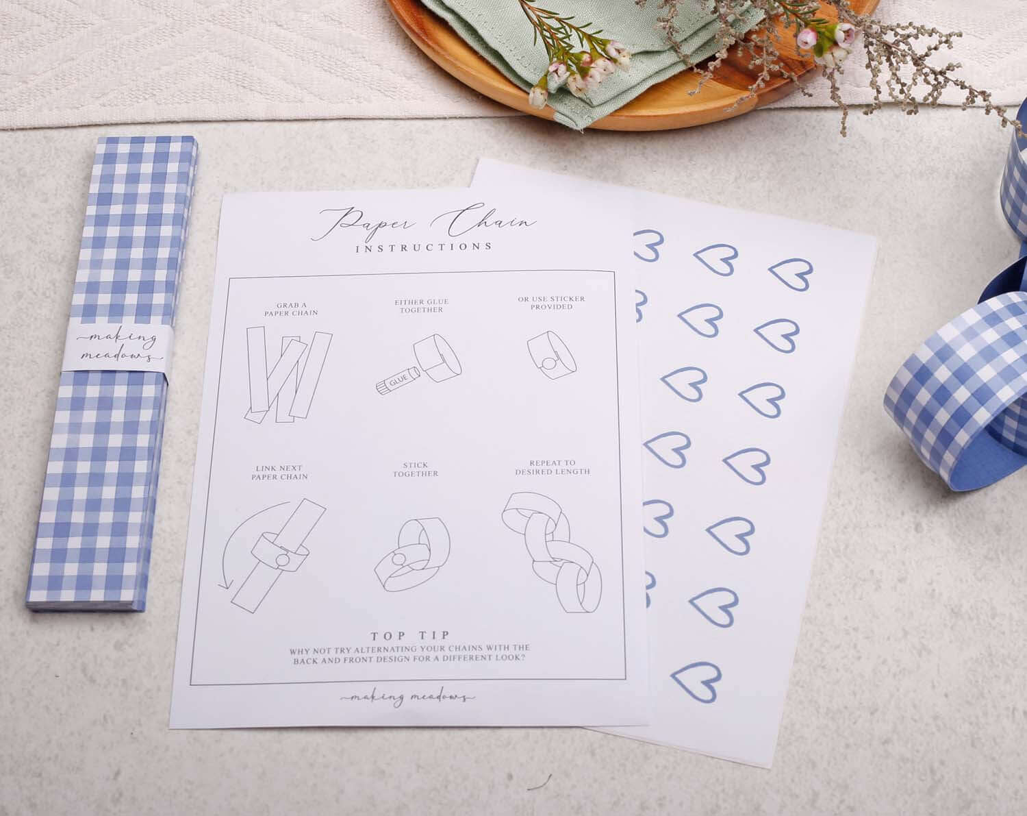 Blue Gingham Paper Chains instructions, featuring clear illustrations and instructions on how to create paper chains.