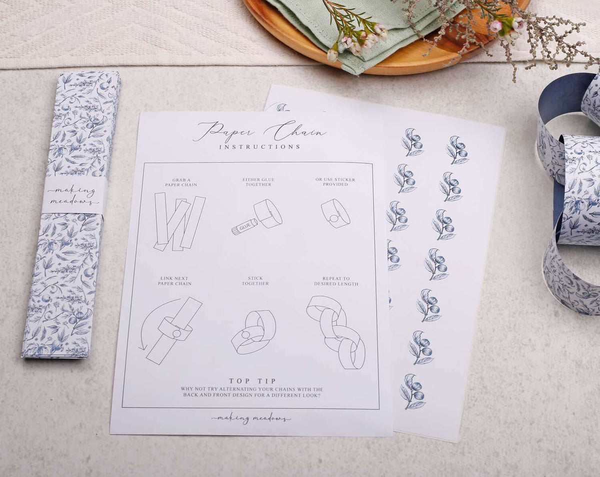 Blue Garden Paper Chains instructions with decorative patterns and assembly tips on a light background.