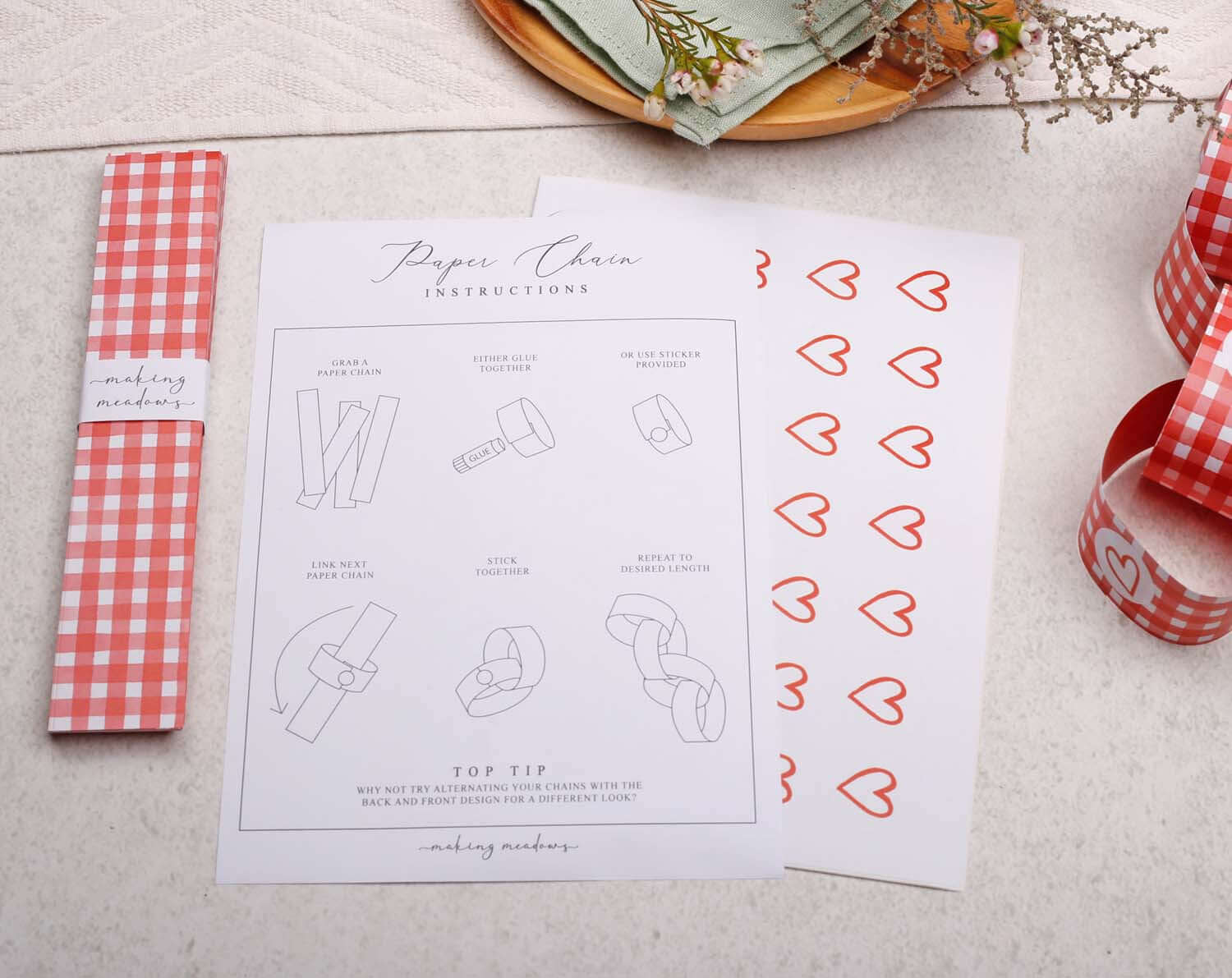 Red Gingham Paper Chains instructions with decorative hearts and crafting tips on a light background.