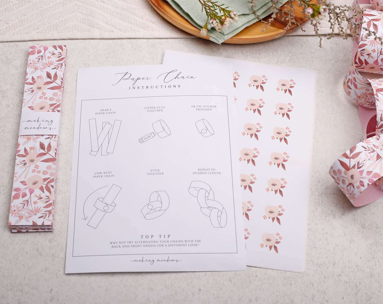 Instructions for making Pink Floral Paper Chains, featuring step-by-step guide and floral design patterns.