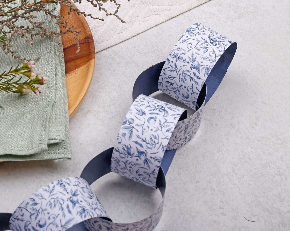 Blue Garden Paper Chains garland featuring floral patterns and navy accents, perfect for home decoration.