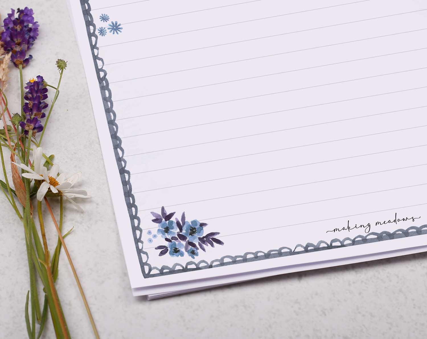A4 writing paper with blue floral scalloped edge border. Stationery designed by Making Meadows