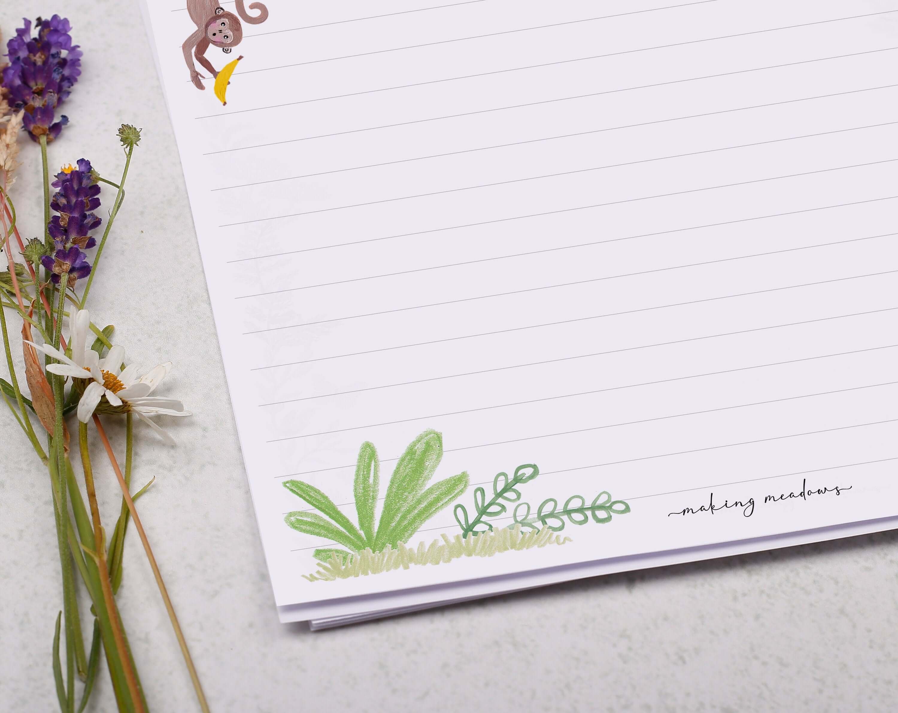 A4 writing paper with dinosaurs. Stationery designed by Making Meadows