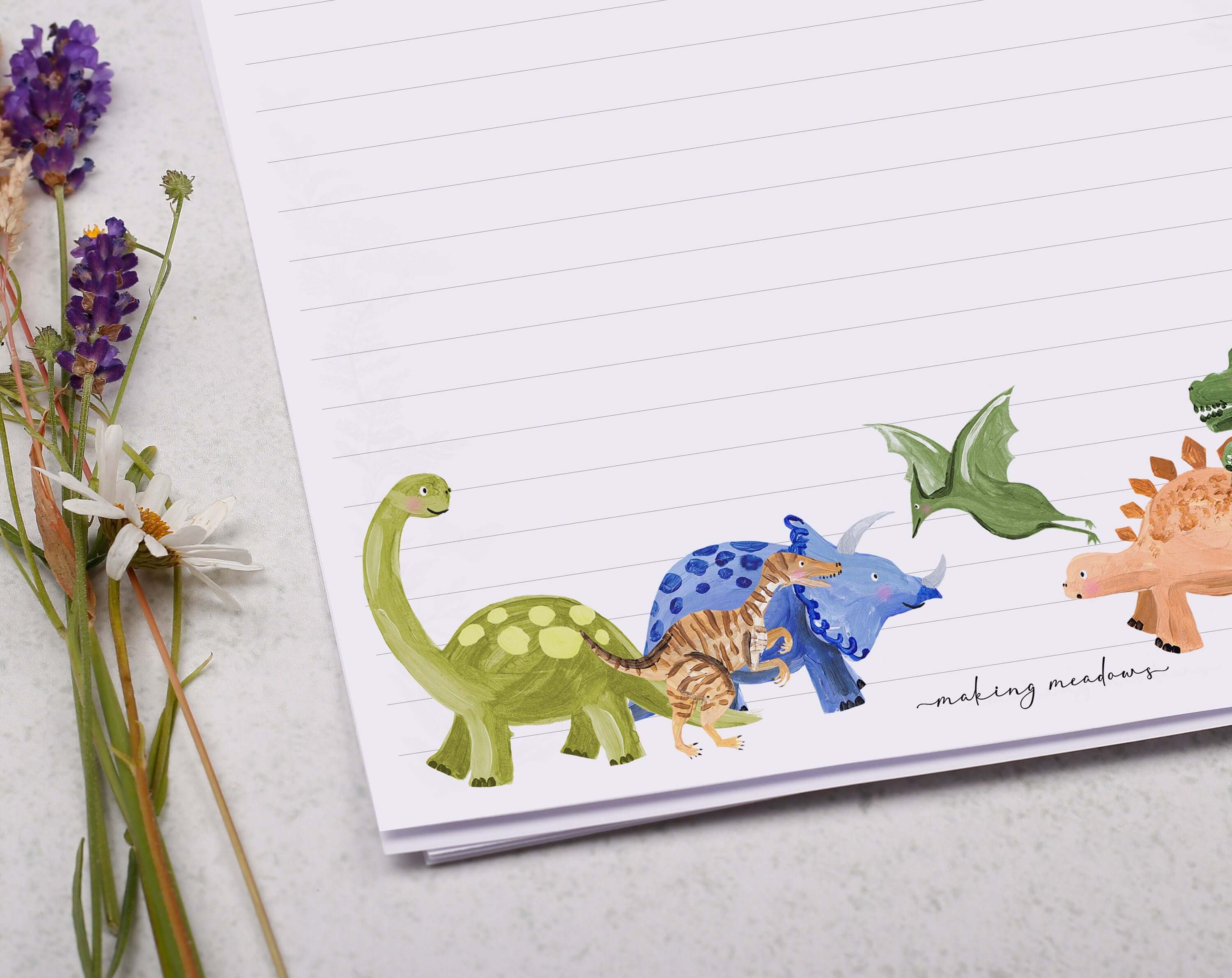 A4 writing paper with dinosaurs. Stationery designed by Making Meadows
