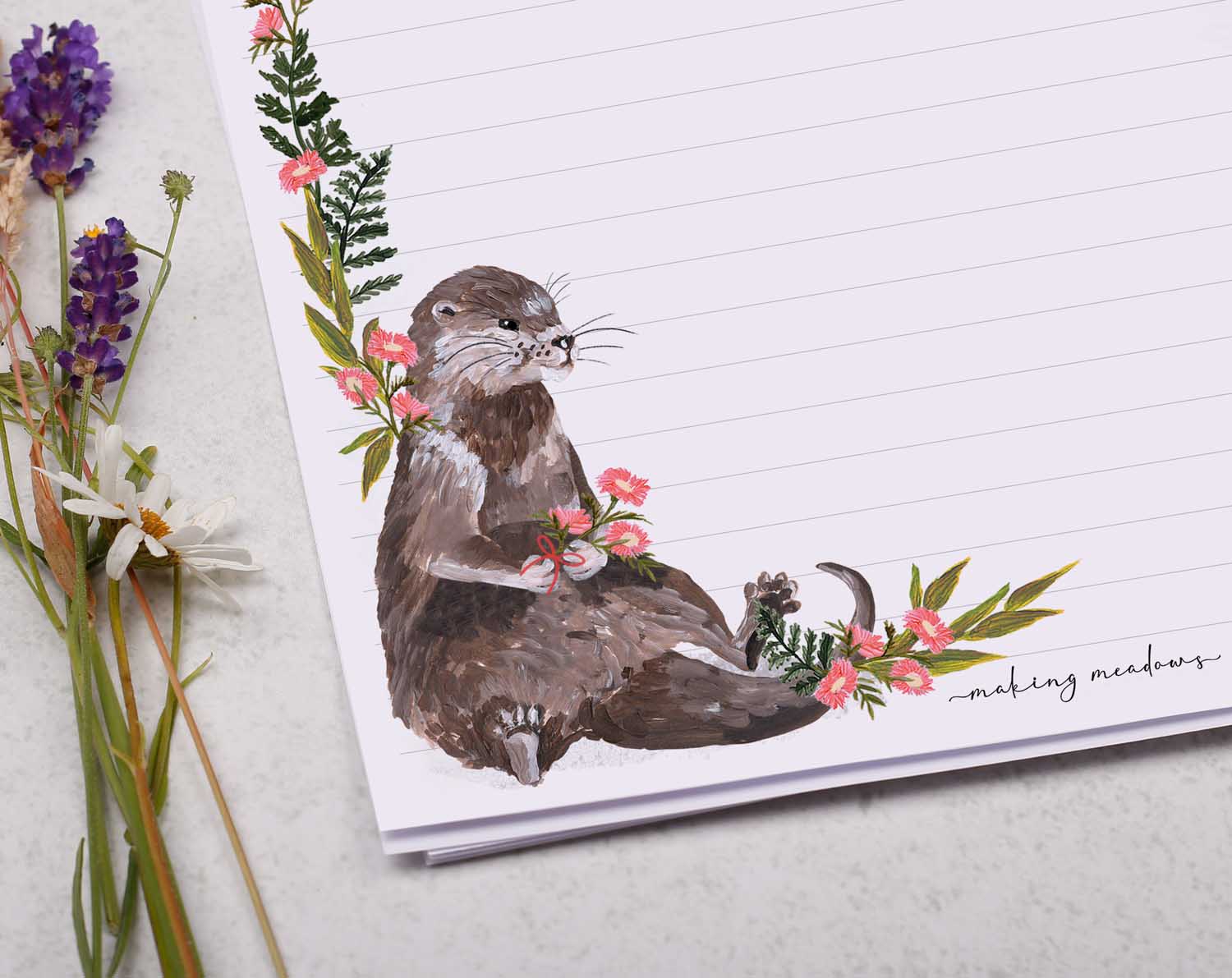 A4 writing paper with otter and pink floral border. Stationery designed by Making Meadows