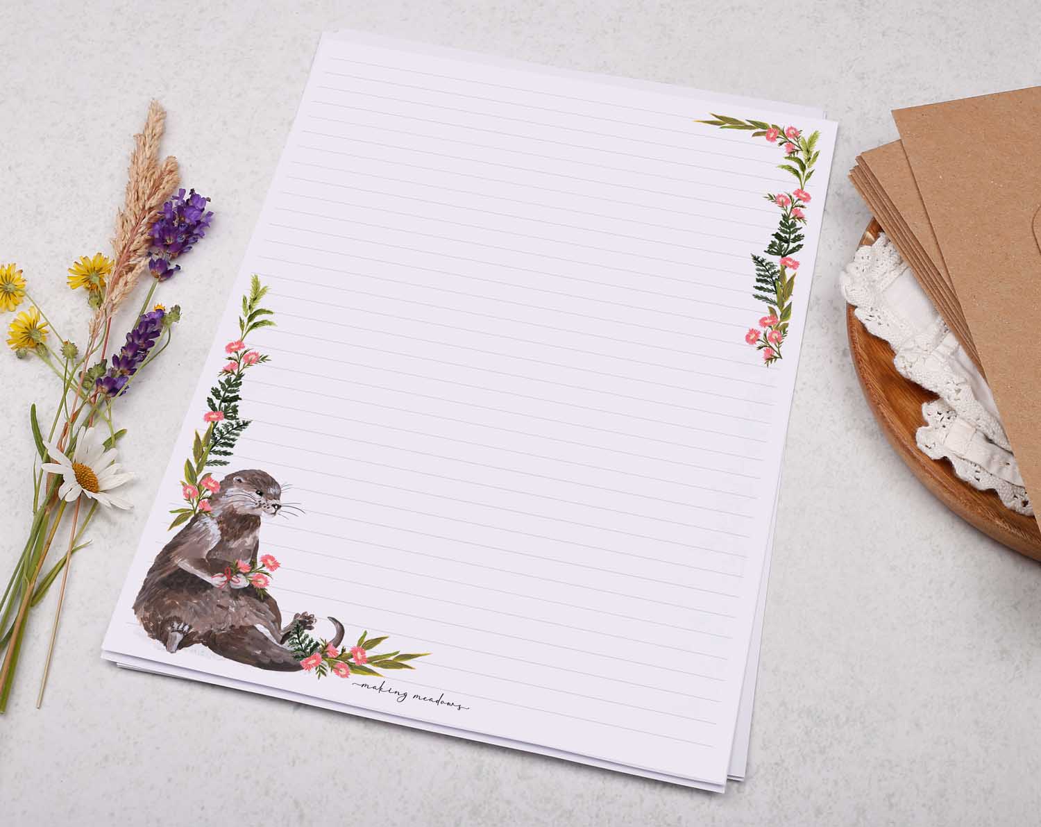 A4 writing paper with otter and pink floral border. Stationery designed by Making Meadows