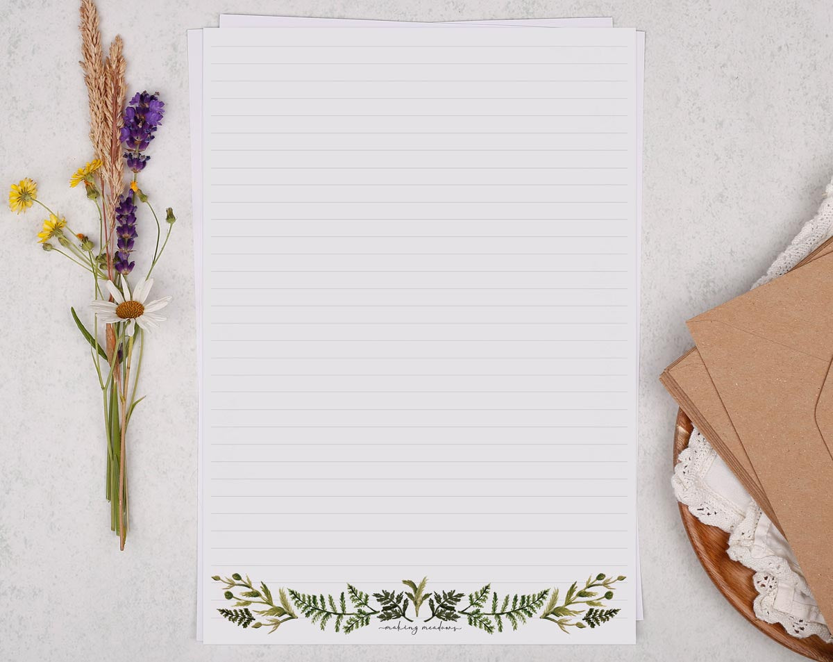 A4 letter writing paper sheets with a watercolour botanical border design along the bottom.