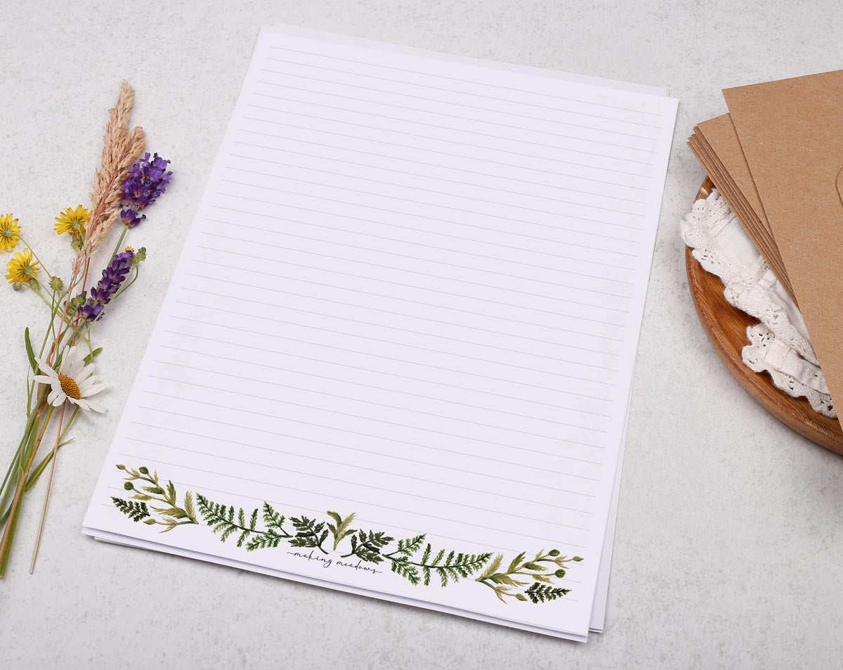 A4 letter writing paper sheets with a watercolour botanical border design along the bottom.