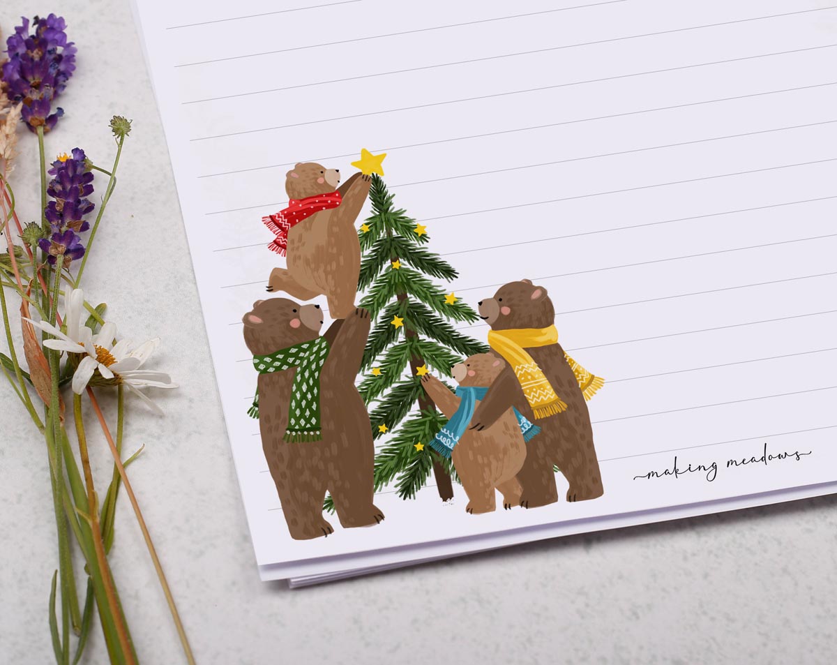 A4 Christmas letter writing paper sheets with a festive design. A family of bears decorate a Christmas tree together, the perfect writing paper for sending those Christmas letters to all your friend's and family.