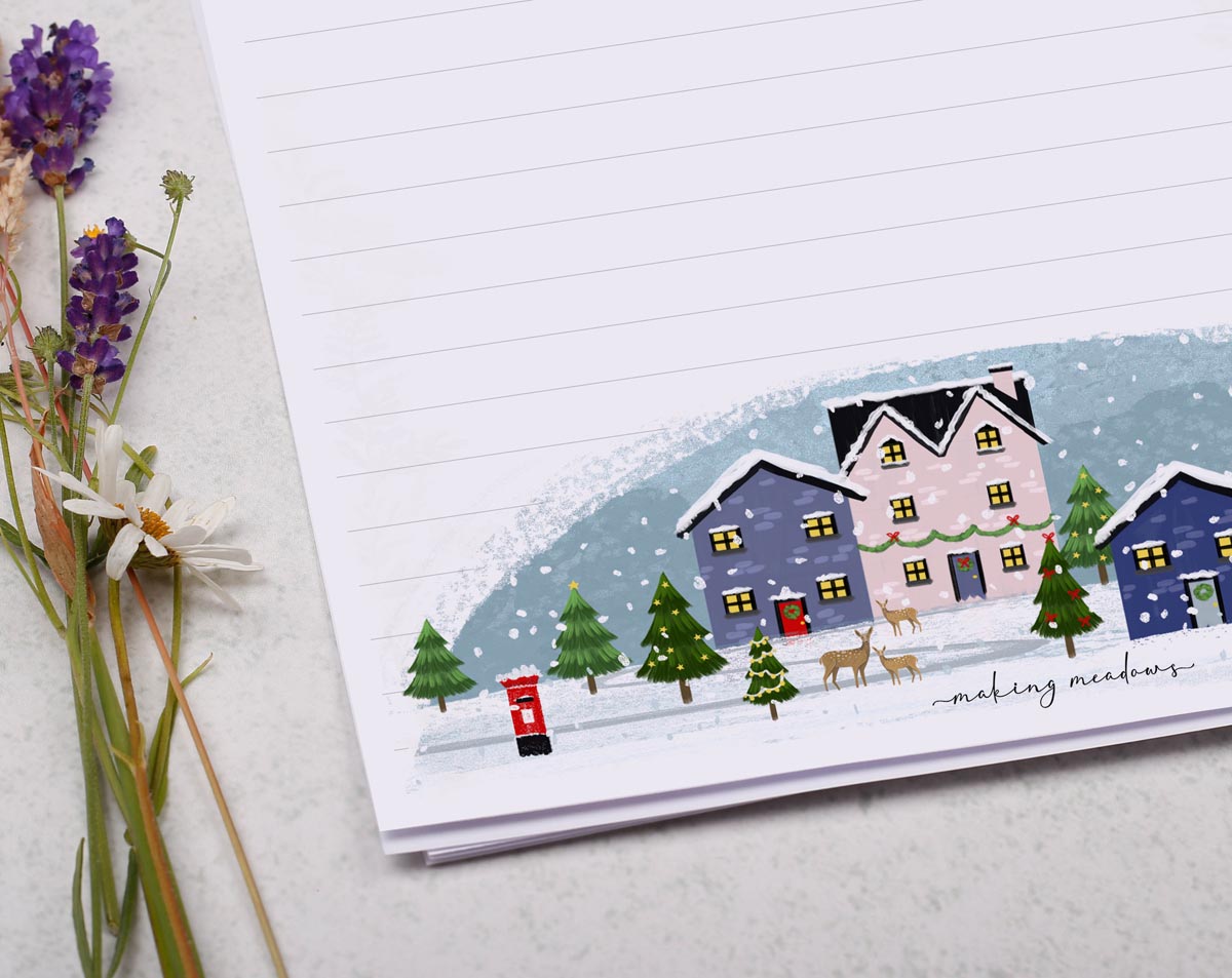 A4 Christmas letter writing paper sheets with a snowy village design