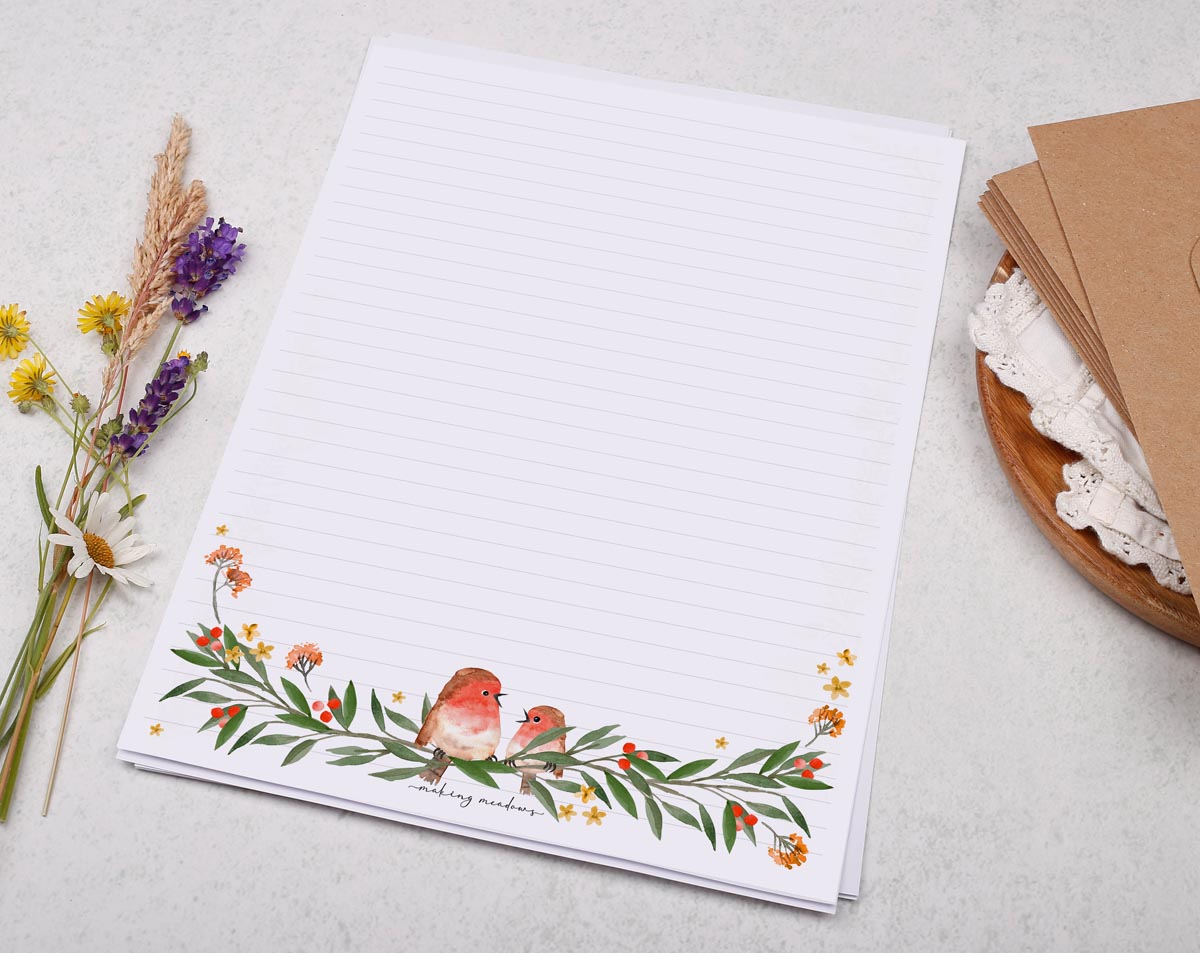 Festive A4 letter writing paper sheets with a foliage and red robin border.