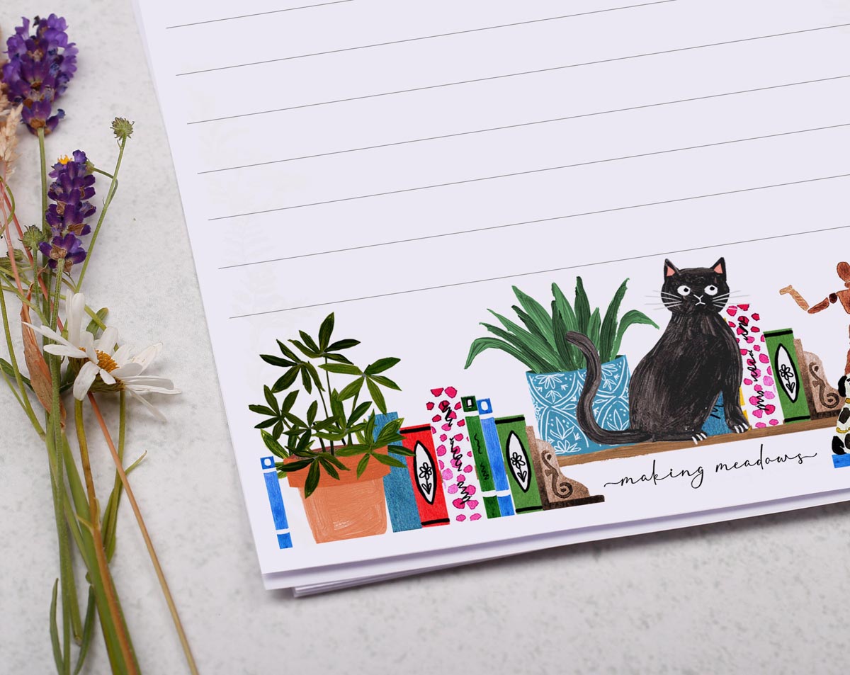 A5 letter writing paper sheets with a quirky illustration of a shelf filled with plants, books and a cheeky cat.