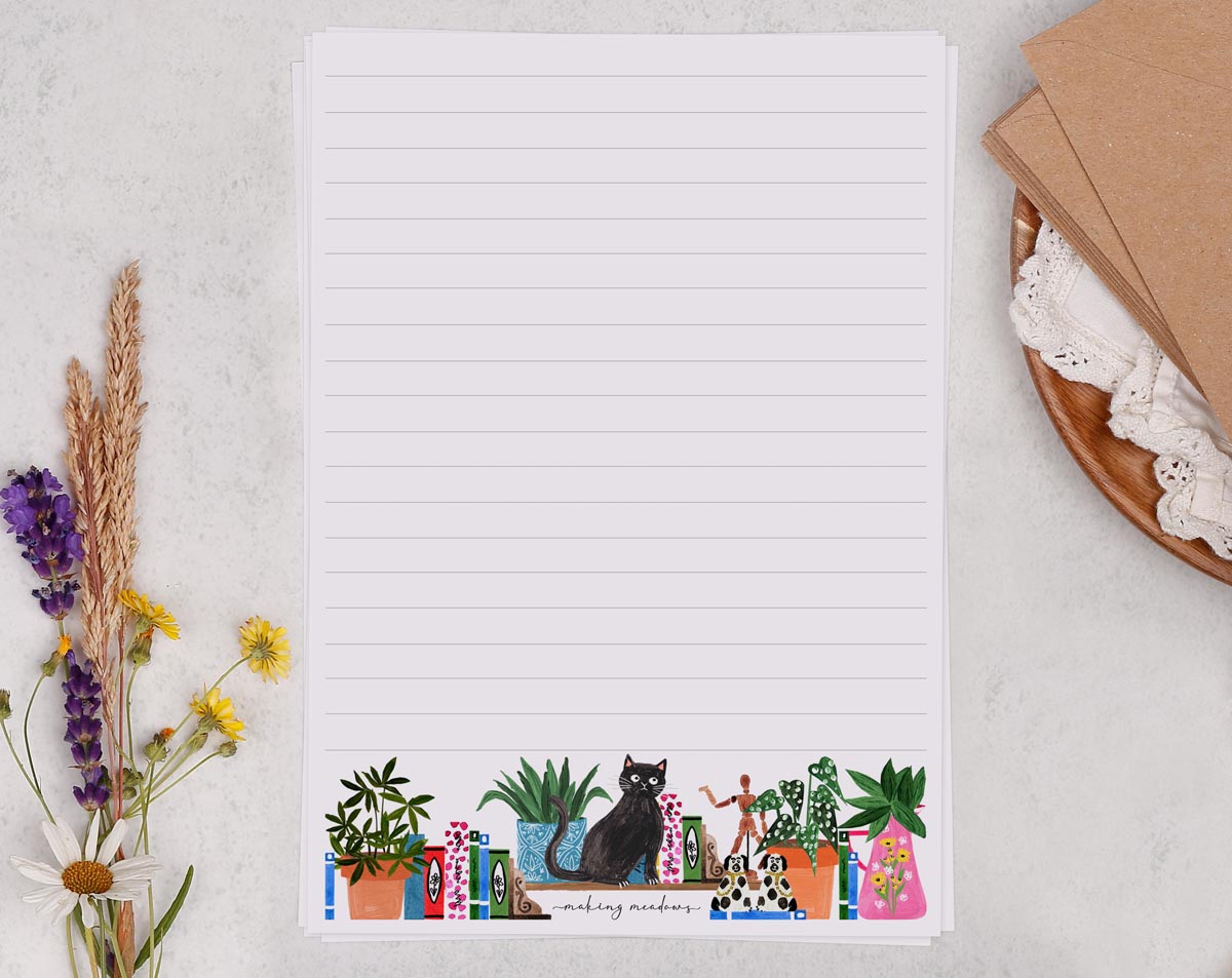 A5 letter writing paper sheets with a quirky illustration of a shelf filled with plants, books and a cheeky cat.
