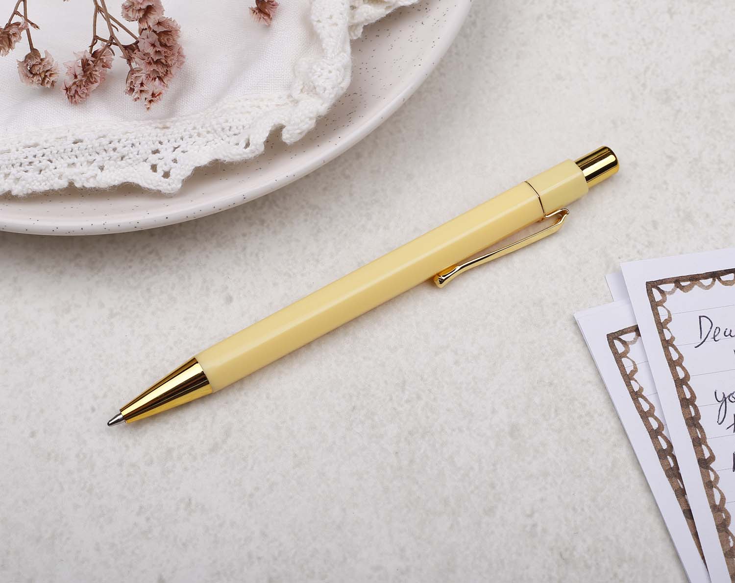 A premium yellow and gold pen with ballpoint tip and hexagonal barrel detail