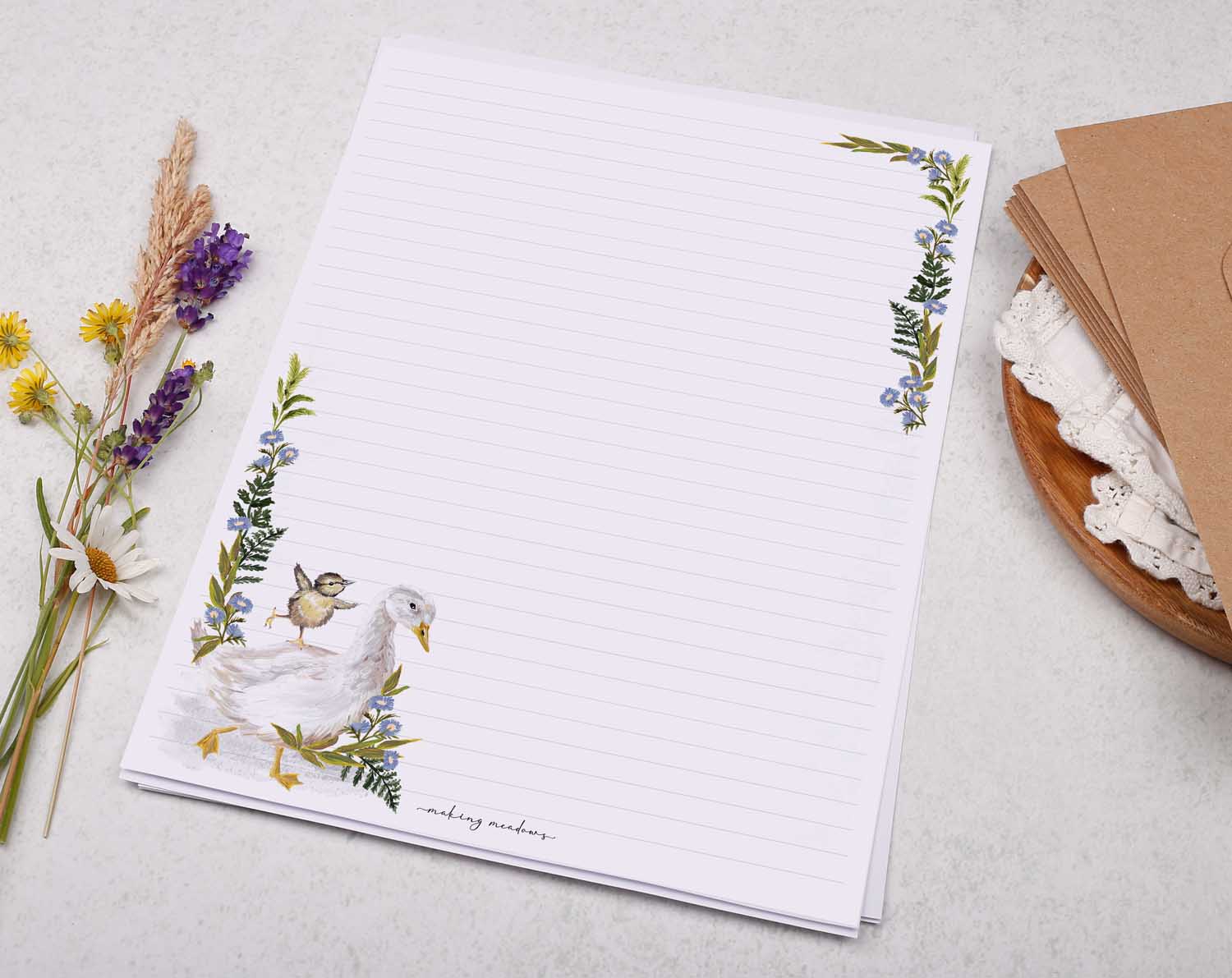 A4 letter writing paper sheets with a cute farmyard goose and baby duck. The birds are complimented by a delicate blue floral watercolour border cascading around the letter paper edge.