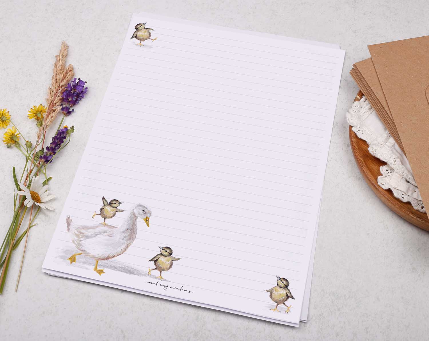 A4 letter writing paper sheets with dancing baby bird chicks dotted around the edge and mummy goose. 