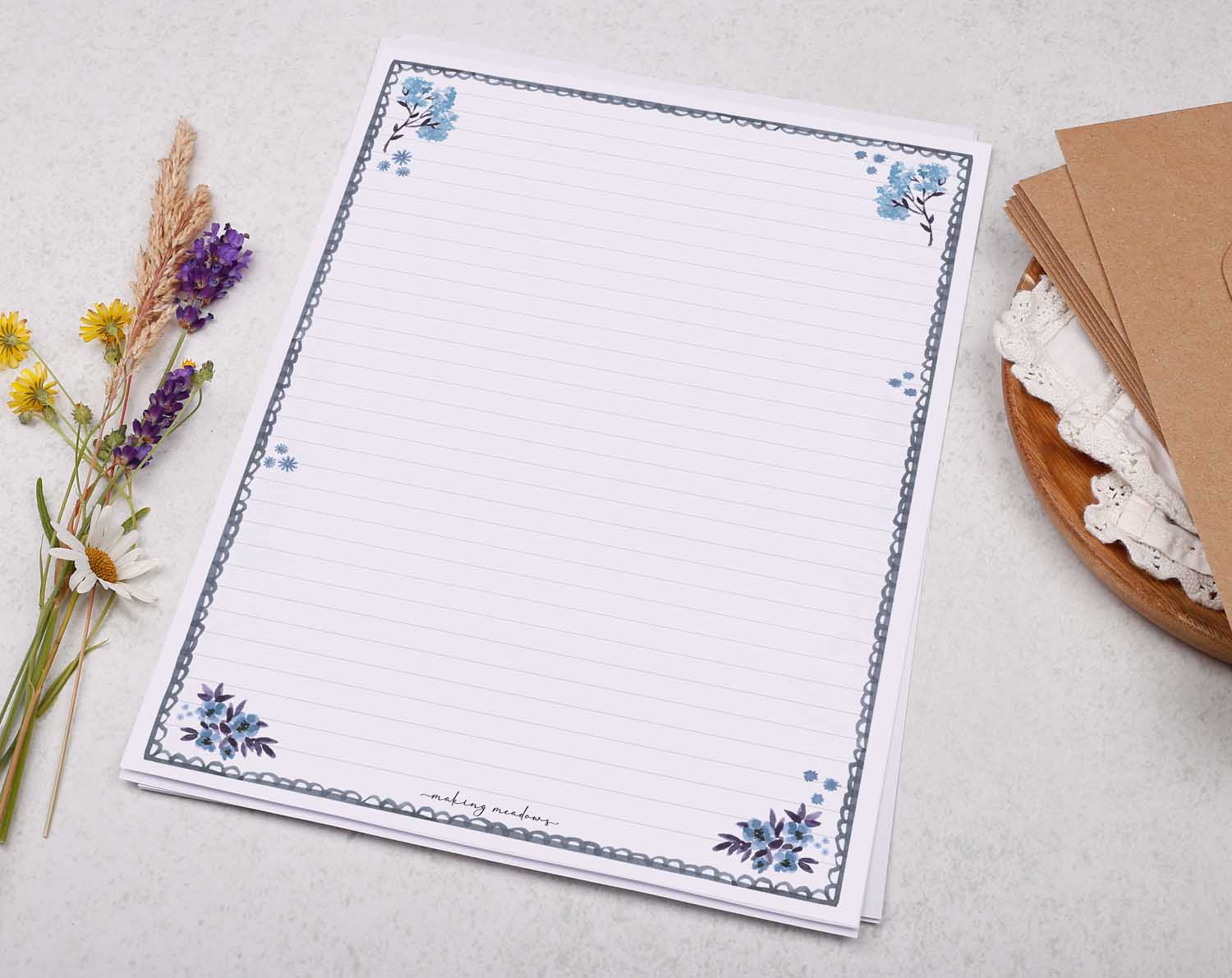 A4 letter writing paper sheets with a delicate blue floral border and scalloped edge design. 