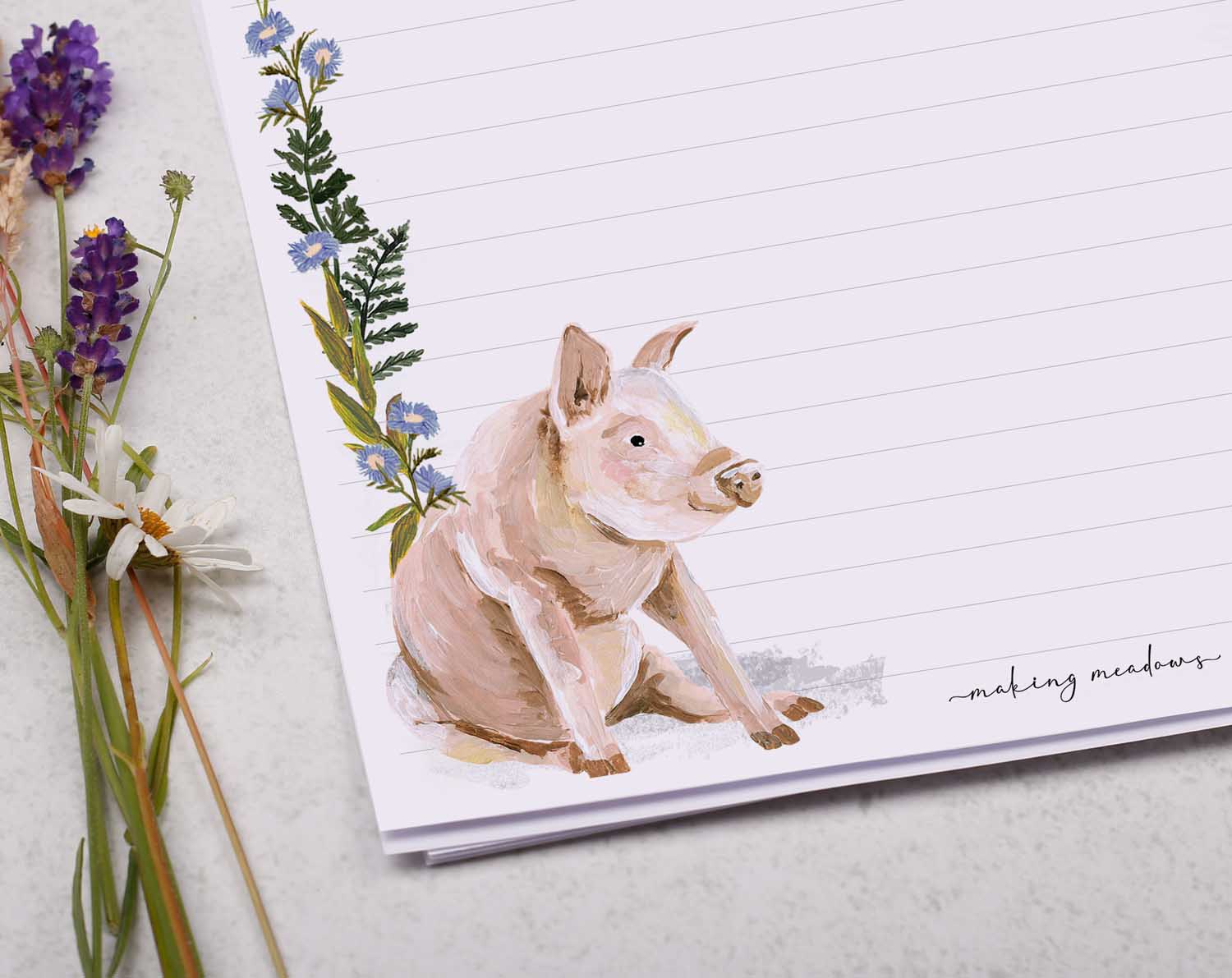 A4 letter writing paper sheets with a cute pair of farmyard pigs and a delicate blue floral watercolour border cascading around the letter paper edge.