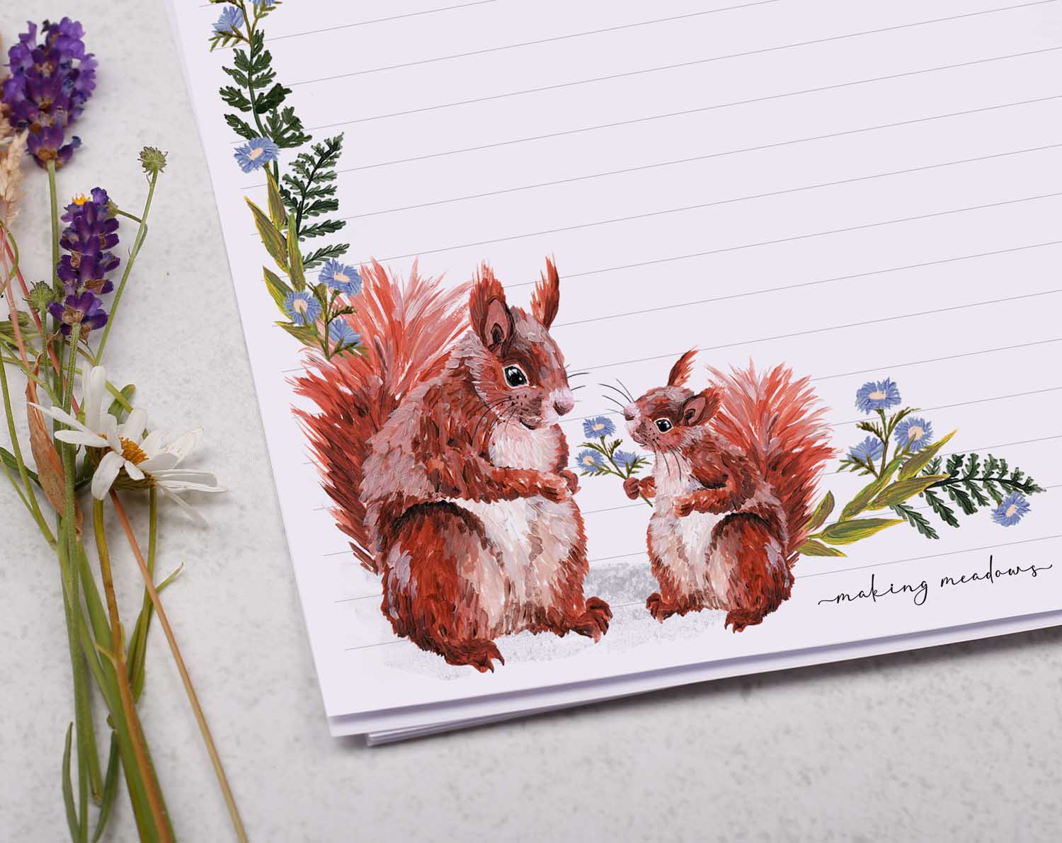 A4 letter writing paper sheets with a cute pair of red squirrels and a delicate blue floral watercolour border cascading around the letter paper edge. 