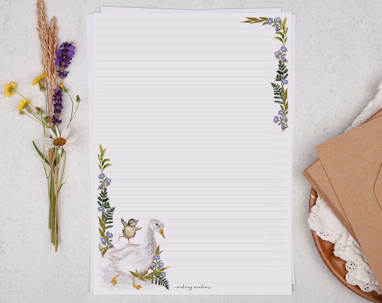 A4 letter writing paper sheets with a cute farmyard goose and baby duck. The birds are complimented by a delicate blue floral watercolour border cascading around the letter paper edge.
