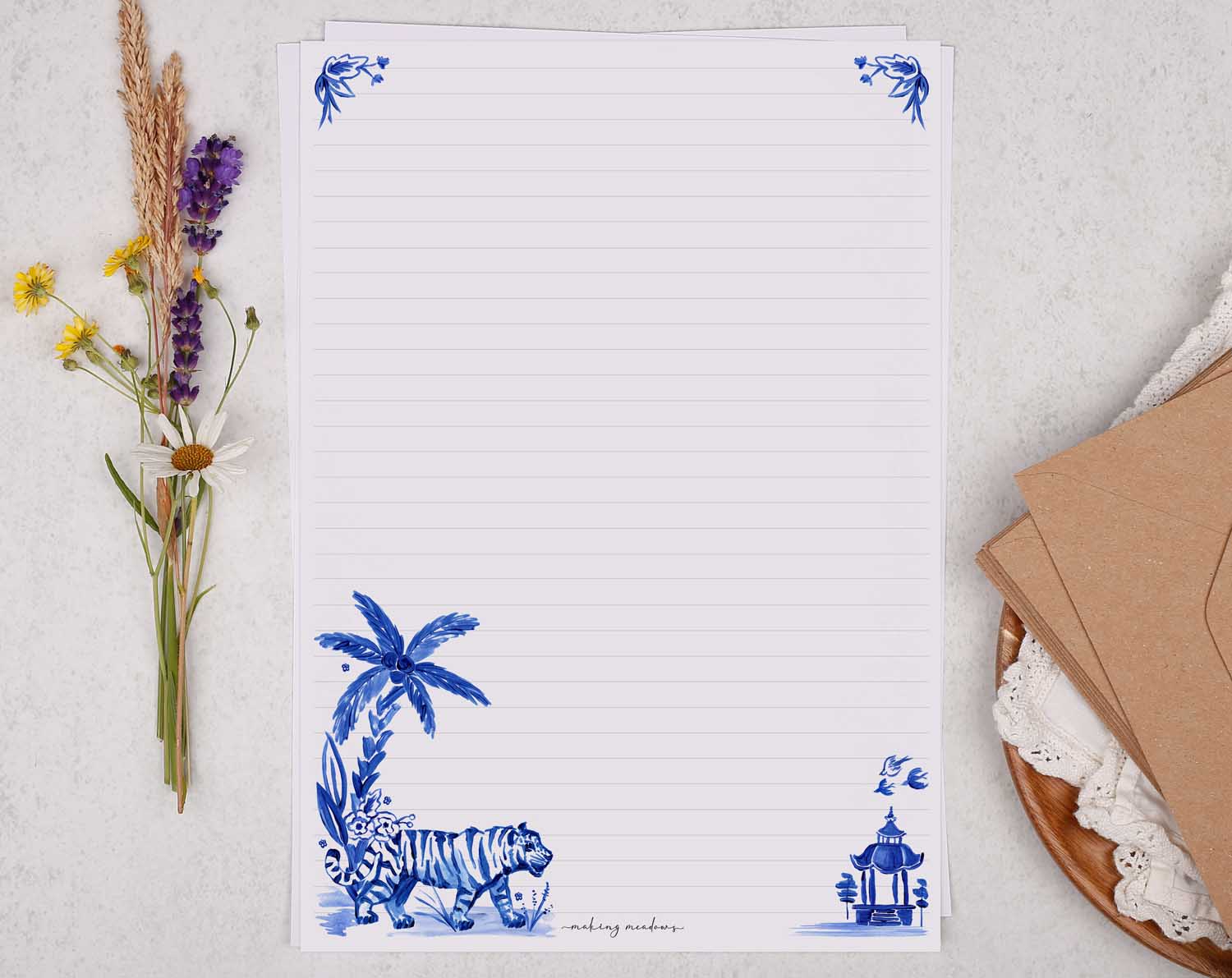 A4 letter writing paper sheets with a tiger and a palm tree blue watercolour border cascading around the letter paper edge.