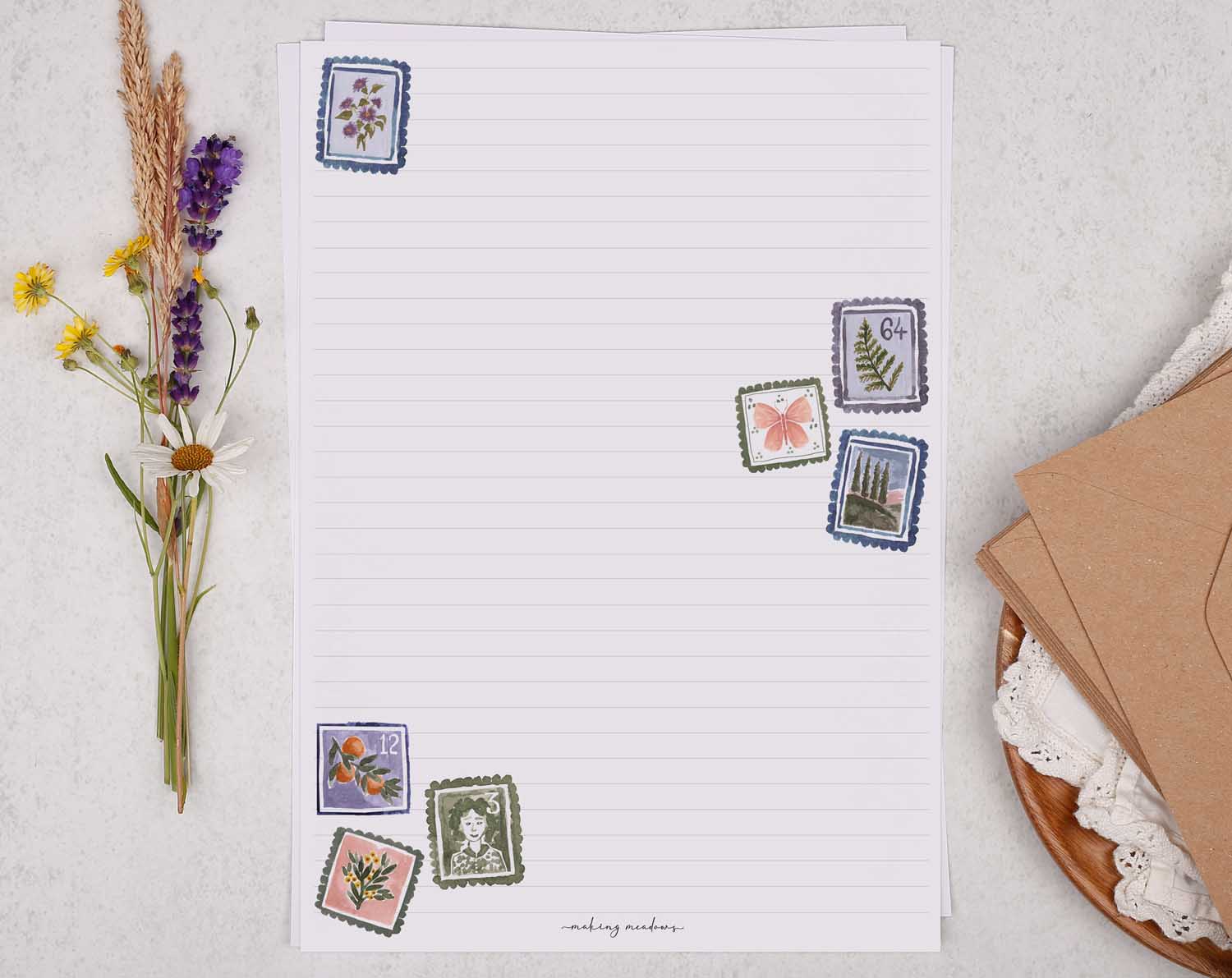 A4 letter writing paper sheets with a pretty scattering of floral postage stamps. The delicate floral watercolour stamp designs cascade around the letter paper edge.