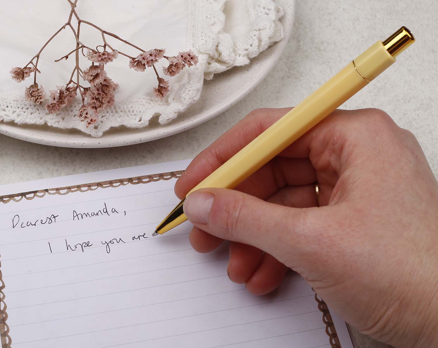 A premium yellow and gold pen with ballpoint tip and hexagonal barrel detail