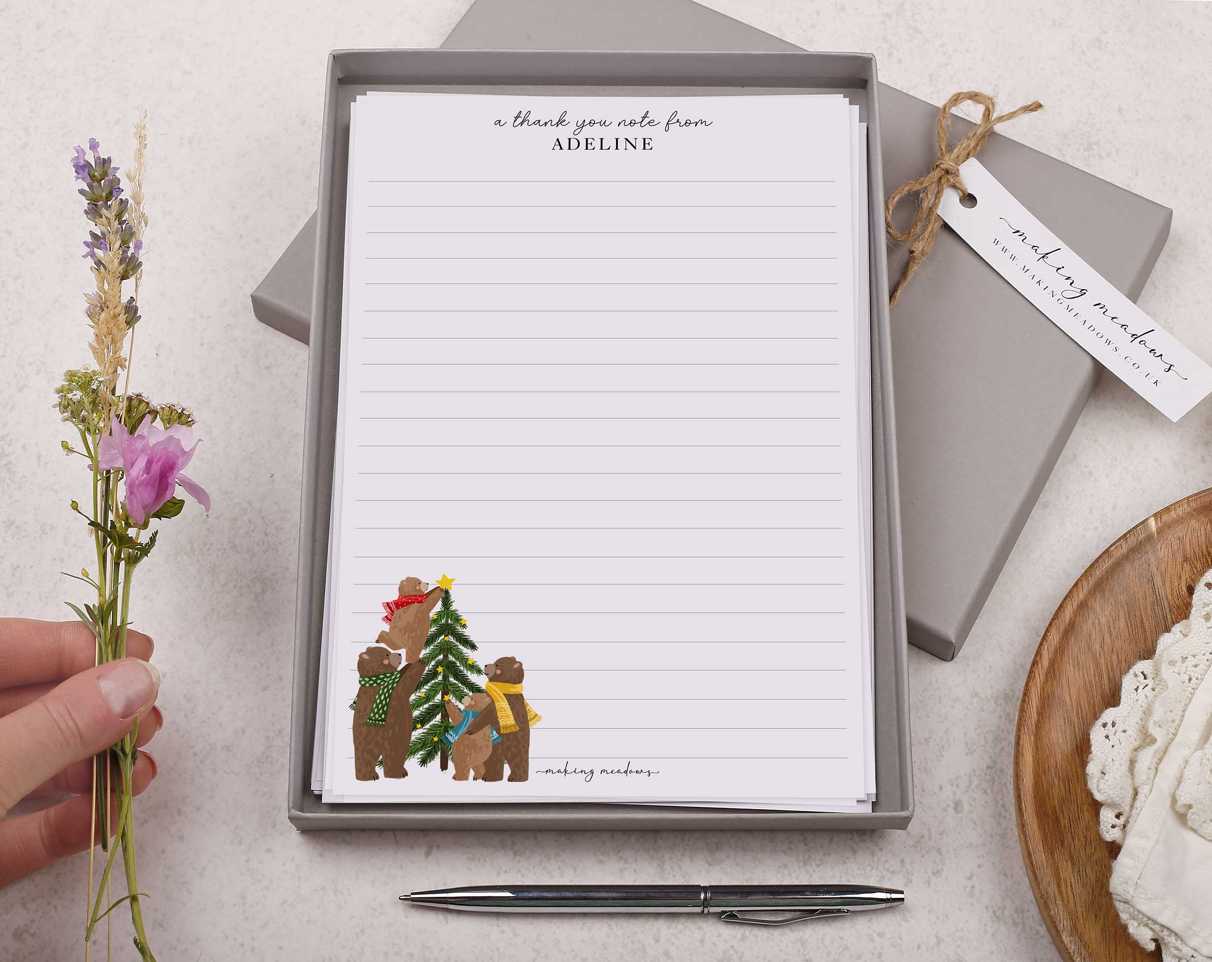 Premium personalised A5 letter writing paper set with a family of woodland bears decorating a Christmas tree. 