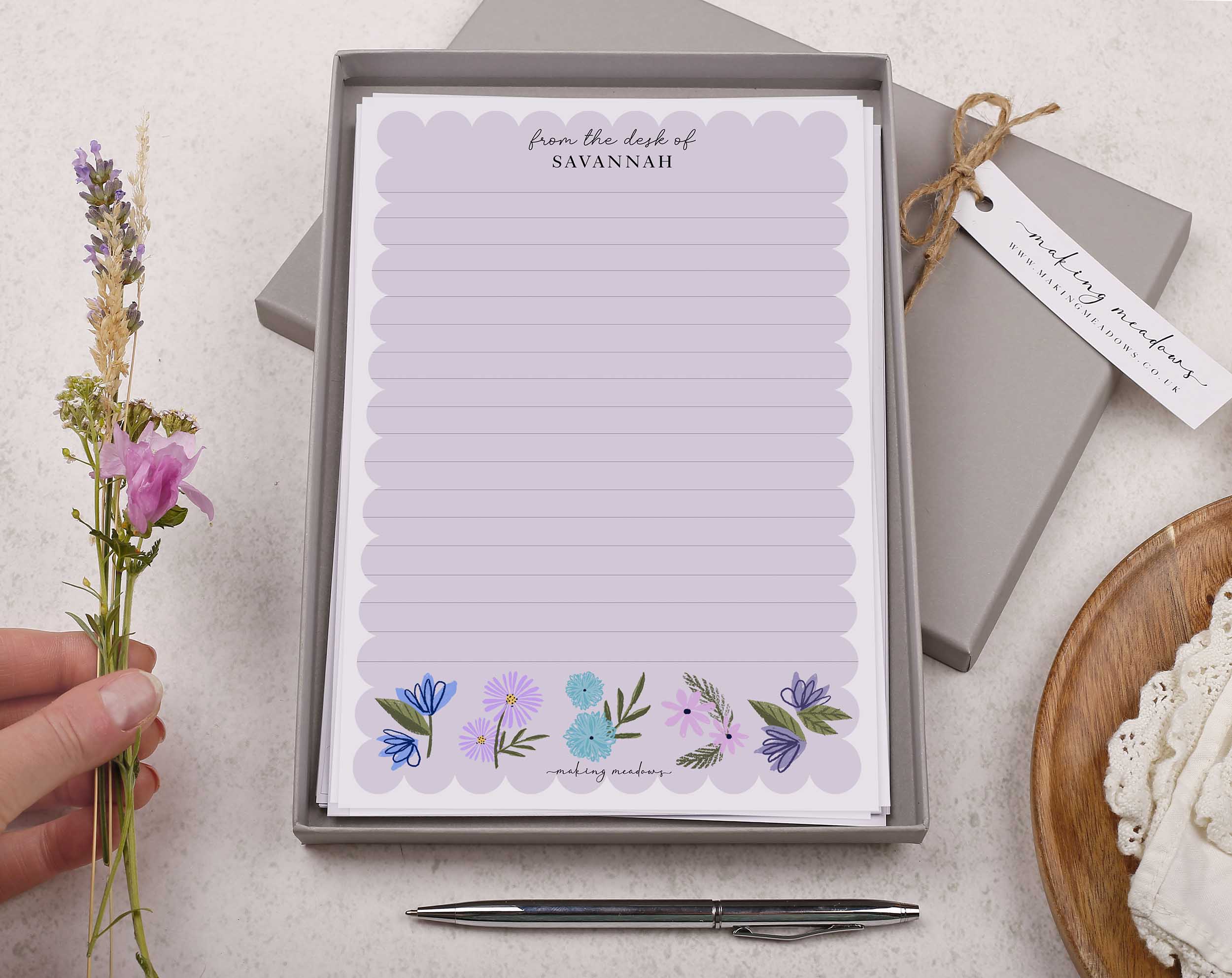 Premium personalised A5 letter writing paper set with beautiful lilac flowers along the bottom and a super cute scalloped edge border. 