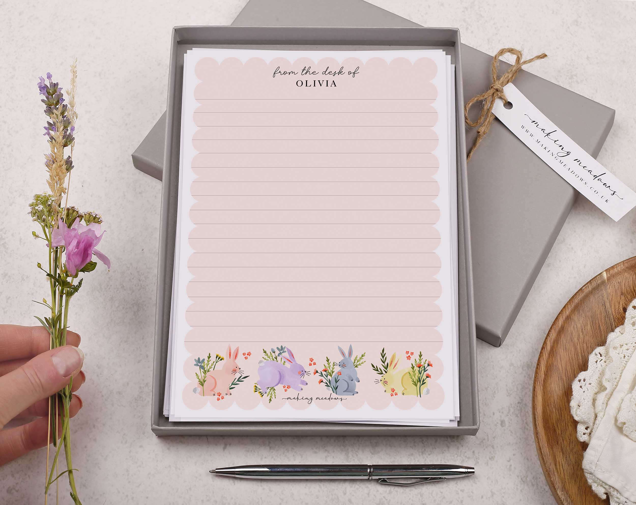 Premium personalised A5 letter writing paper set with bunny rabbits jumping through flowers and a super cute pink scalloped edge border