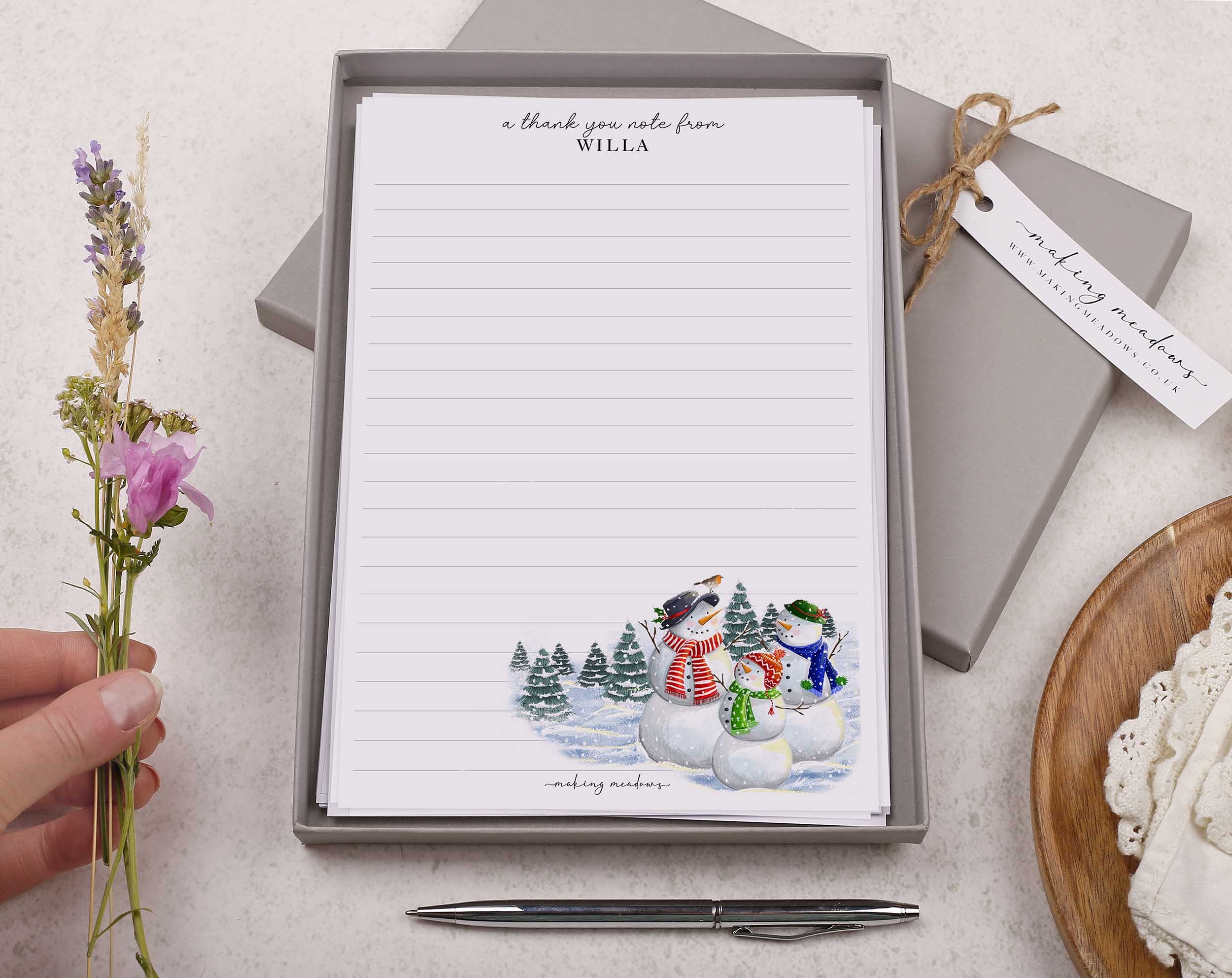 Premium personalised A5 letter writing paper set with a family of snowmen in the forest.