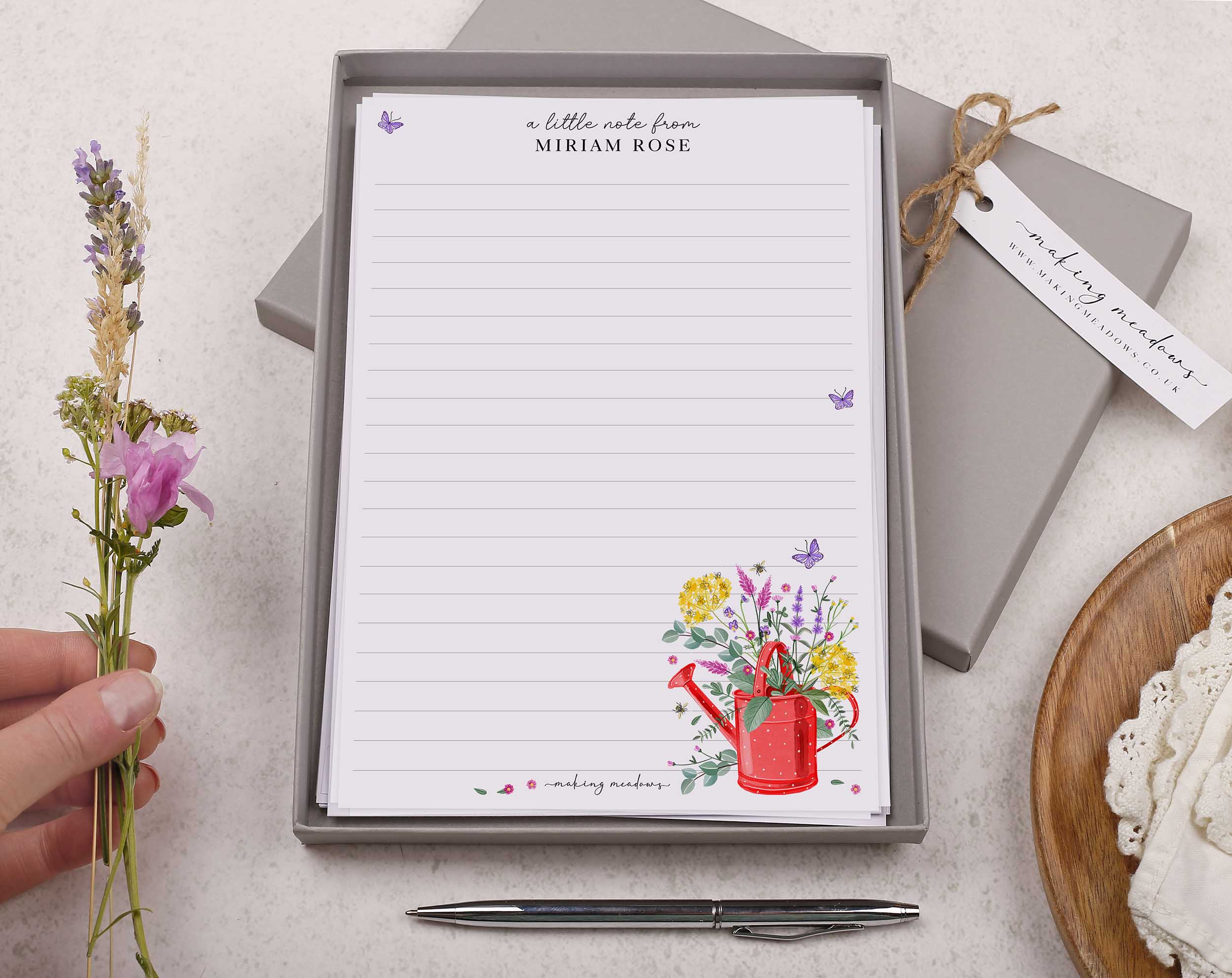 Premium personalised A5 letter writing paper set with a watering can bursting with cottage garden flowers. 