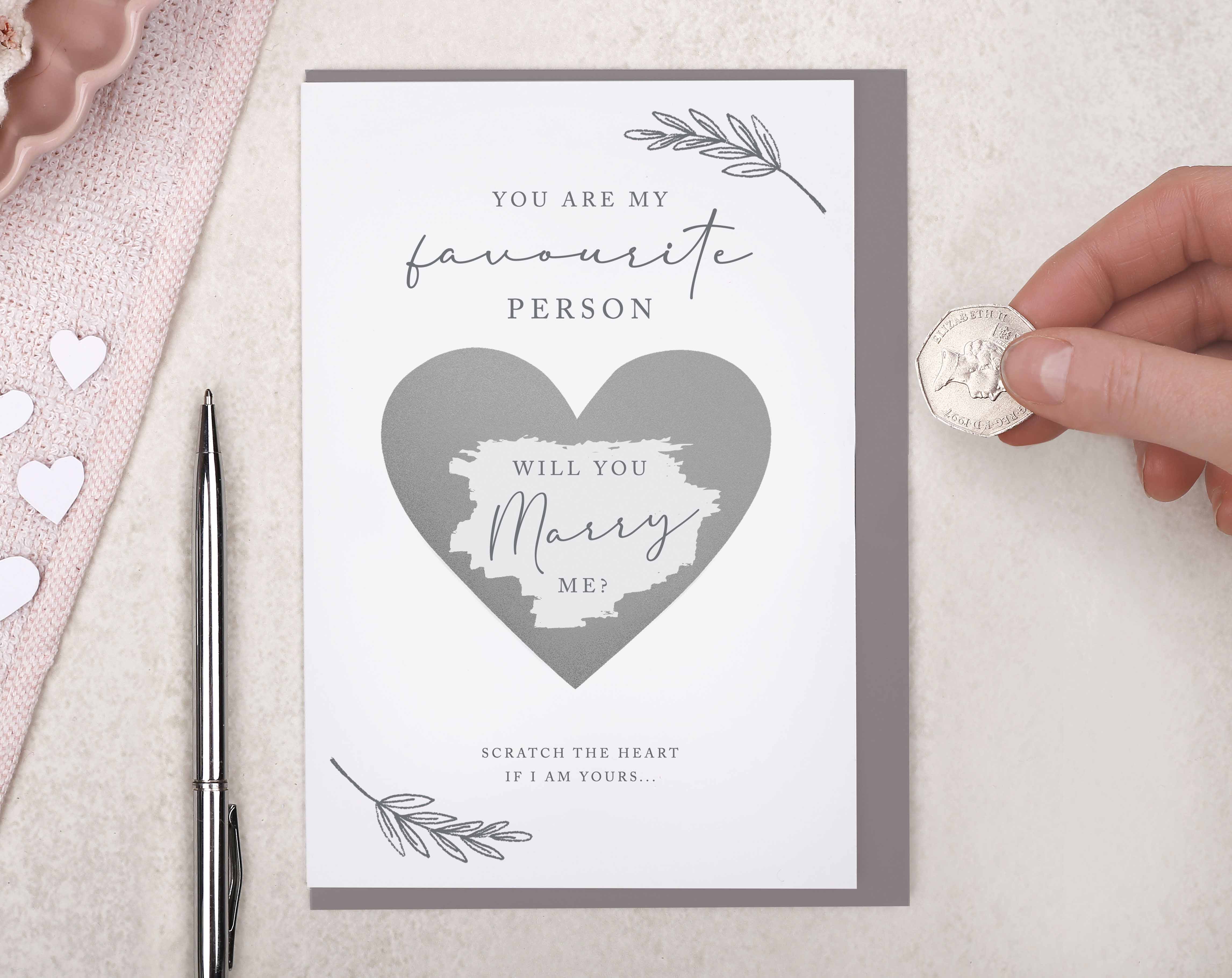 'will you marry me' scratch to reveal proposal card with a simple botanical leaf design