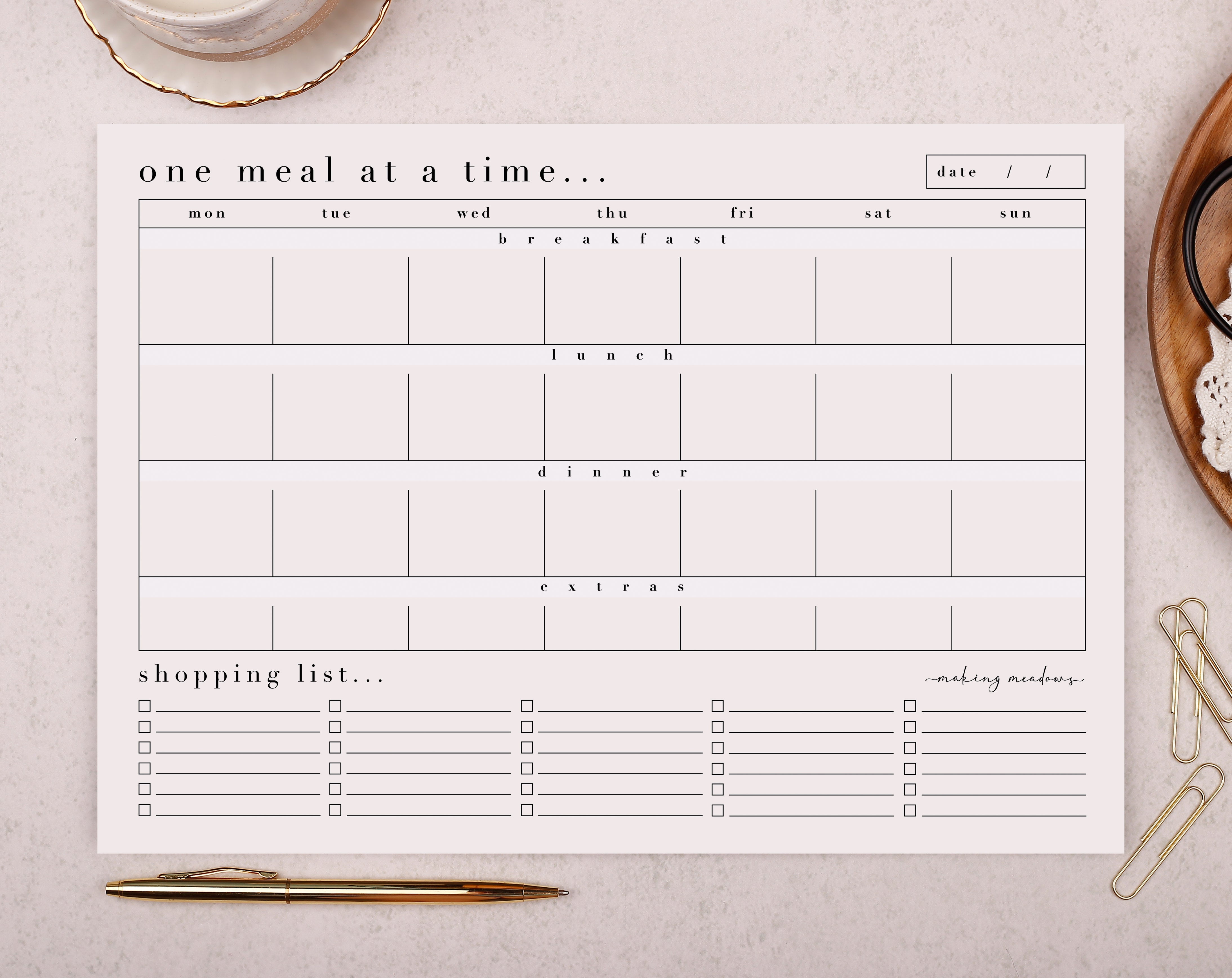 An elegant and simple, light pink tear off weekly meal planner pad with 50 pages