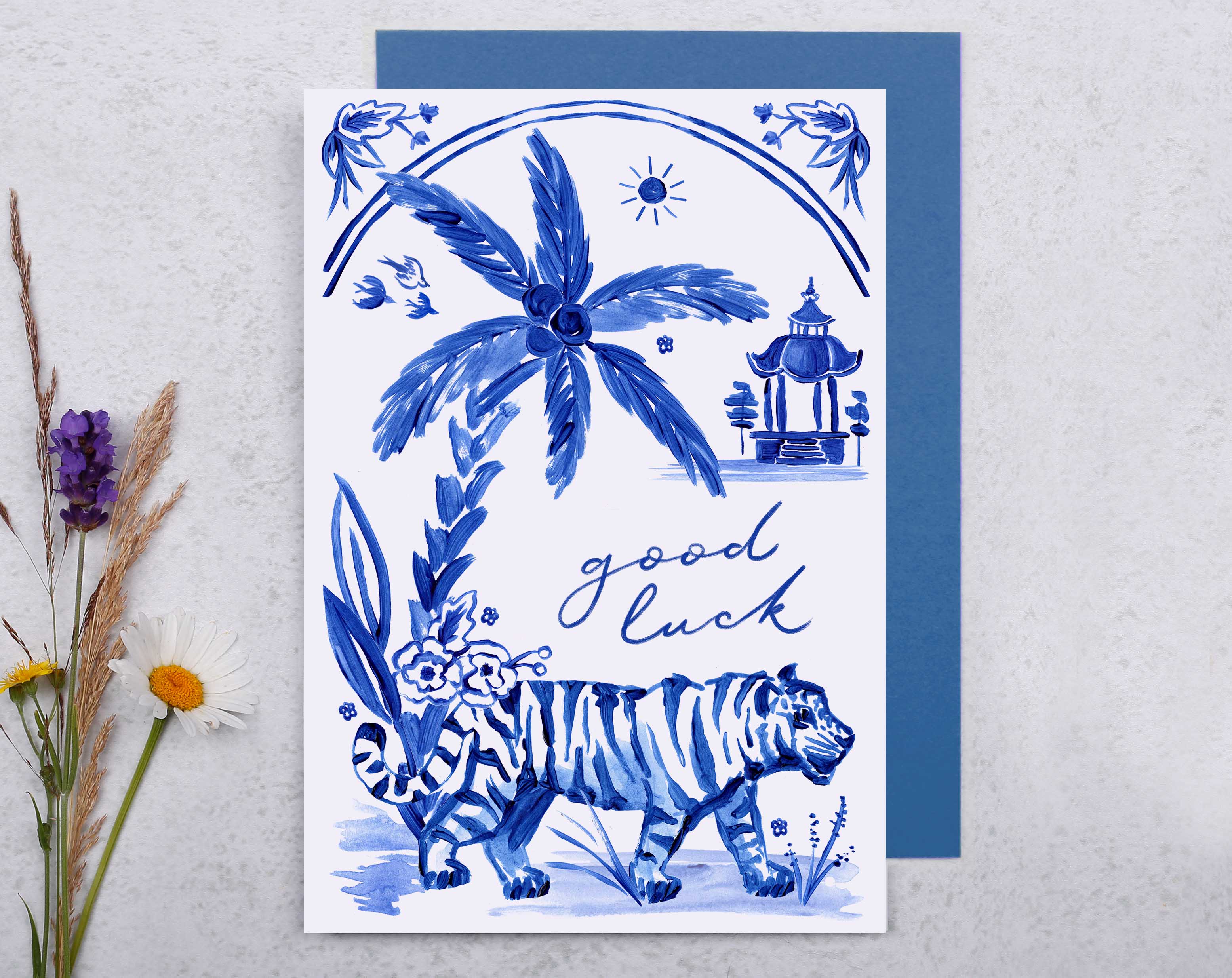 A blue porcelain inspired Good Luck Card with a tiger surrounded by palm trees and tropical flowers. 