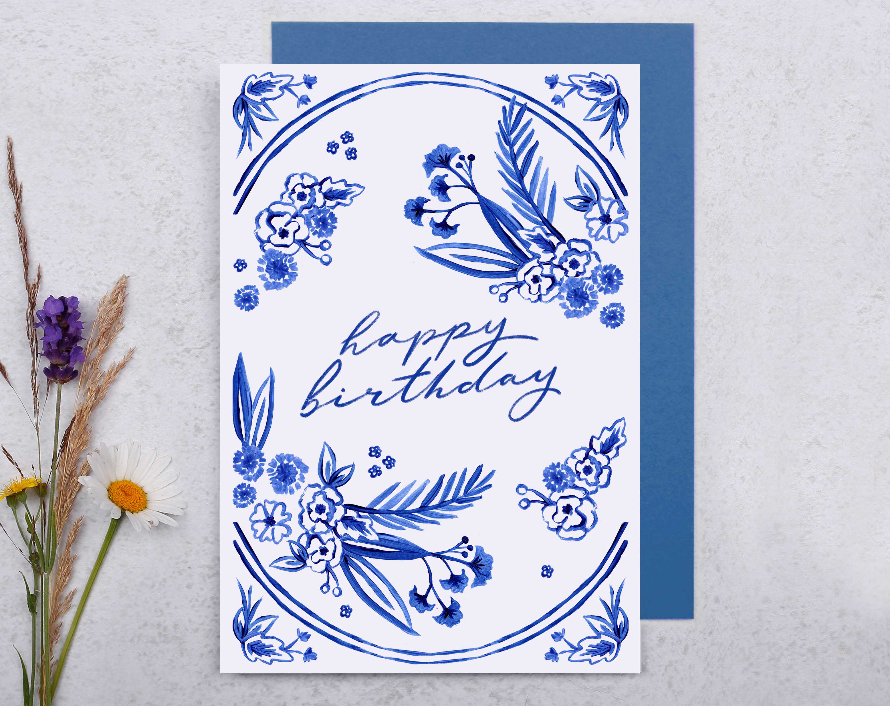 A blue porcelain inspired Happy Birthday Card with hand painted blue flowers. 