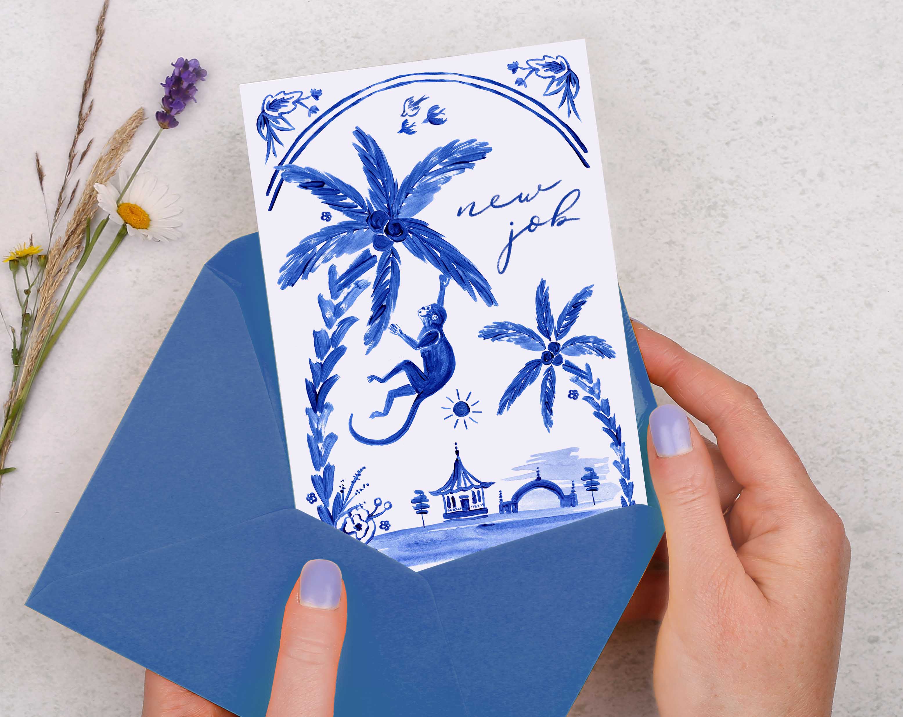 A blue porcelain inspired New Job Card with hand painted blue monkey swinging off a palm tree. 