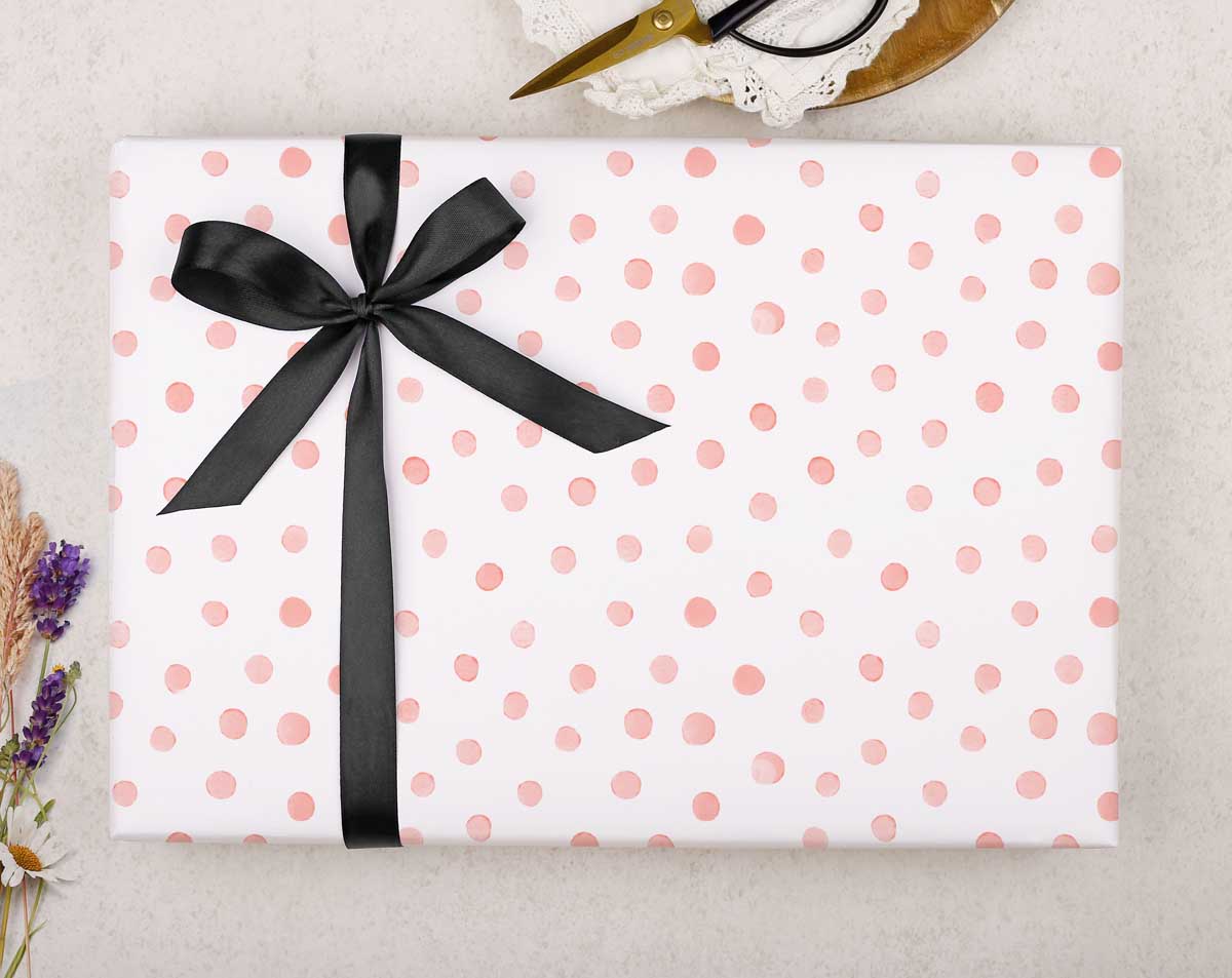 Present, green & white polka dot ribbon, brown wrapping paper